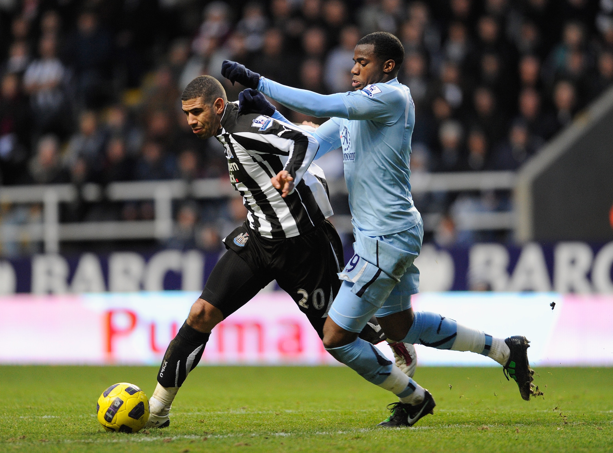 NEWCASTLE UPON TYNE, ENGLAND - JANUARY 22:  Leon Best of Newcastle battles Sebastien Bassong of Spurs during the Barclays Premier League match between Newcastle United and Tottenham Hotspur at St James' Park on January 22, 2011 in Newcastle upon Tyne, Eng