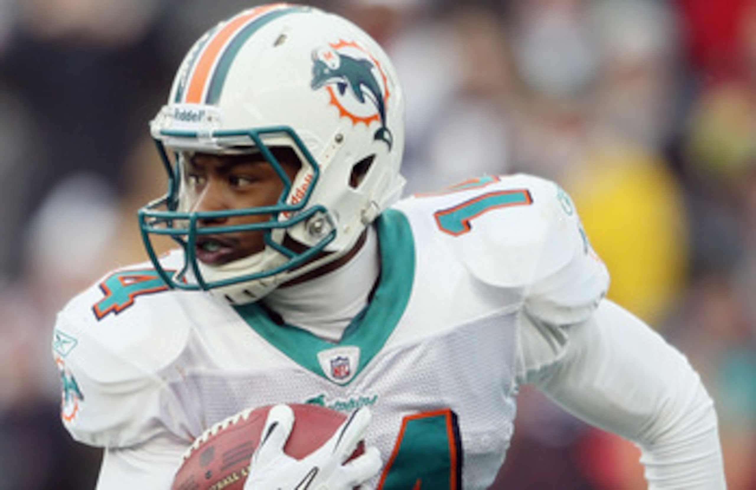 FOXBORO, MA - JANUARY 02:  Marlon Moore #14 of the Miami Dolphins carries the ball in the first half against the New England Patriots on January 2, 2011 at Gillette Stadium in Foxboro, Massachusetts.  (Photo by Elsa/Getty Images)