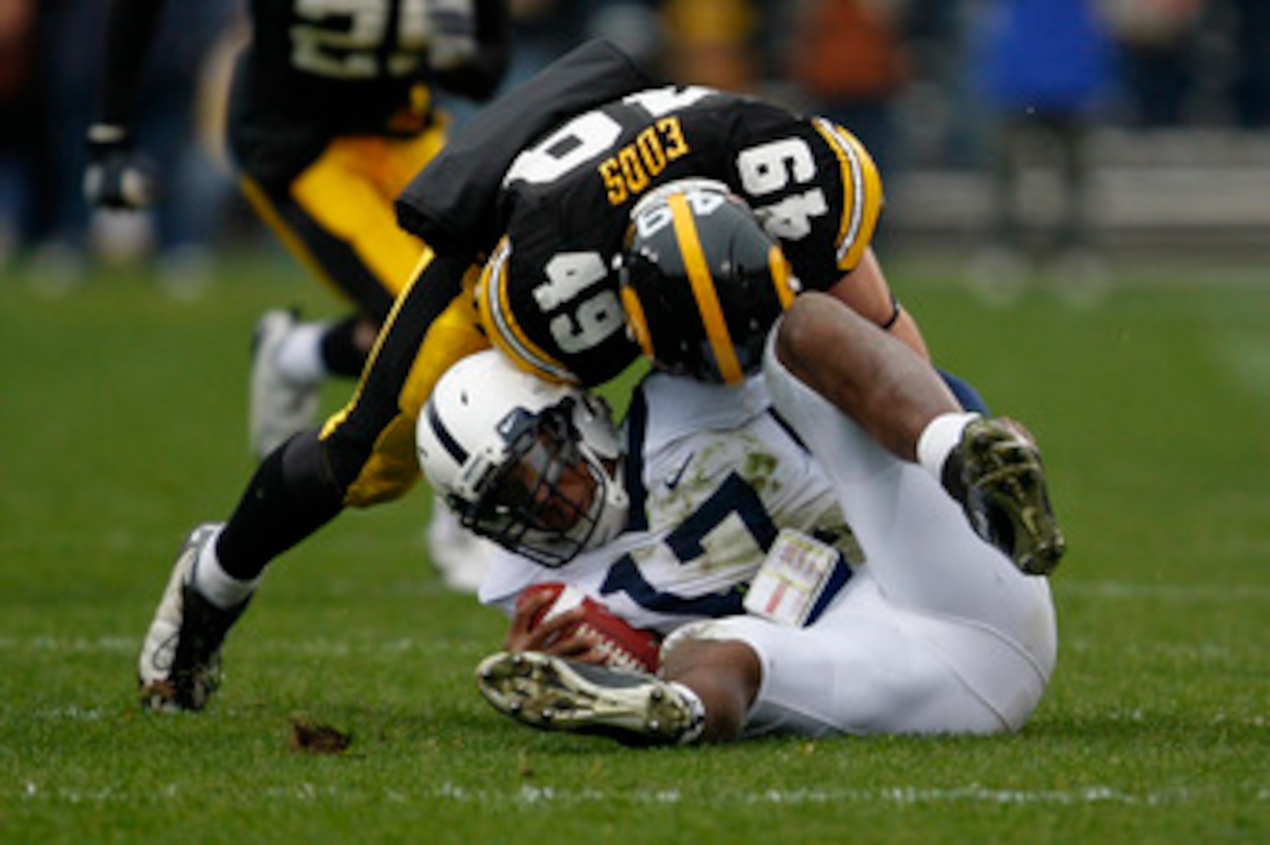 IOWA CITY, IA - NOVEMBER 8:  Line backer A.J. Edds #49 of the Iowa Hawkeyes sacks quarterback Daryll Clark #17 of the Penn State Nittany Lions in the first quarter of play at Kinnick Stadium on November 8, 2008 in Iowa City, Iowa. Iowa defeated Penn State