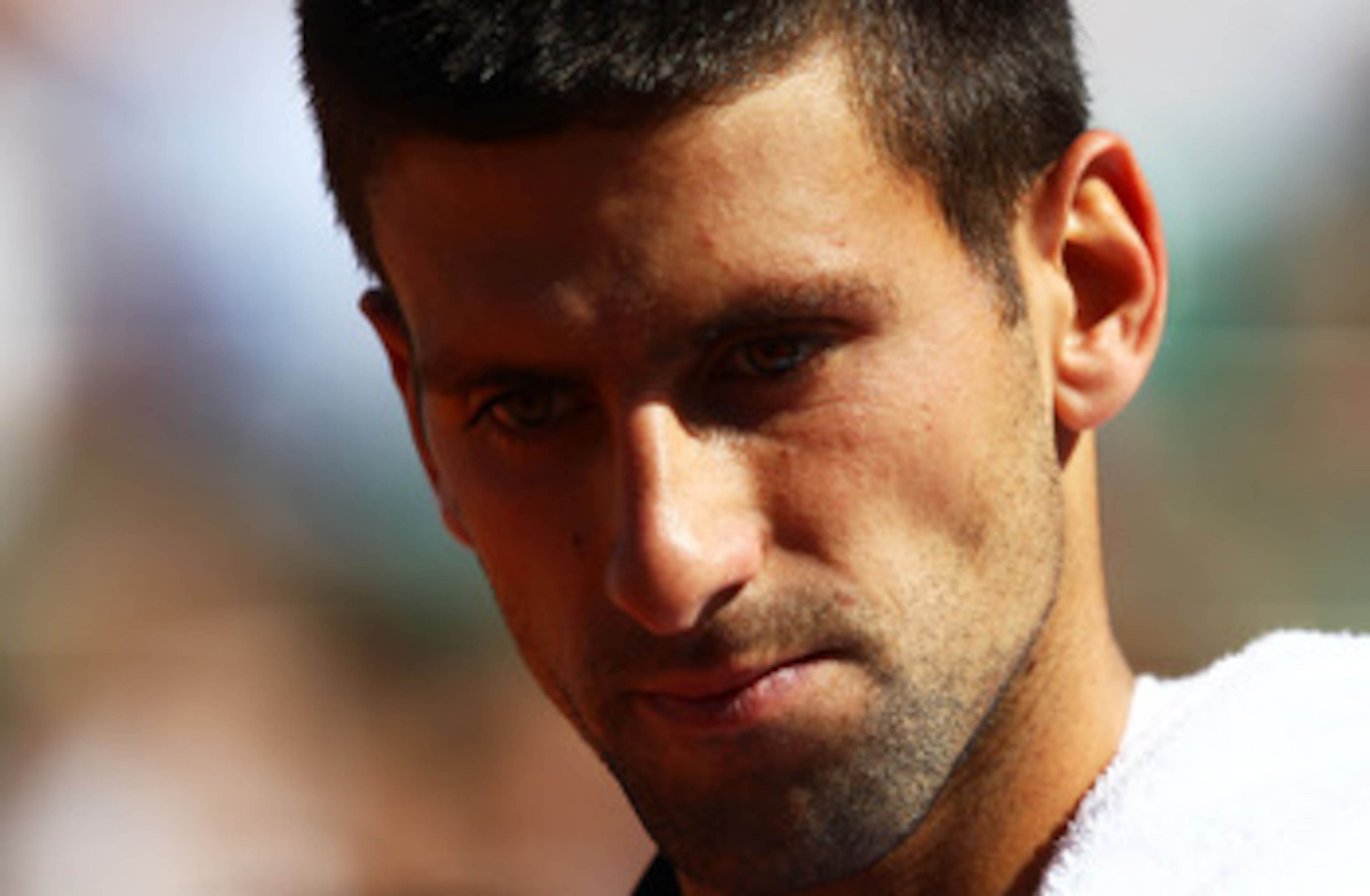 PARIS, FRANCE - MAY 25:  Novak Djokovic of Serbia looks on during the men's singles round two match between Victor Hanescu of Romania and Novak Djokovic of Serbia on day four of the French Open at Roland Garros on May 25, 2011 in Paris, France.  (Photo by