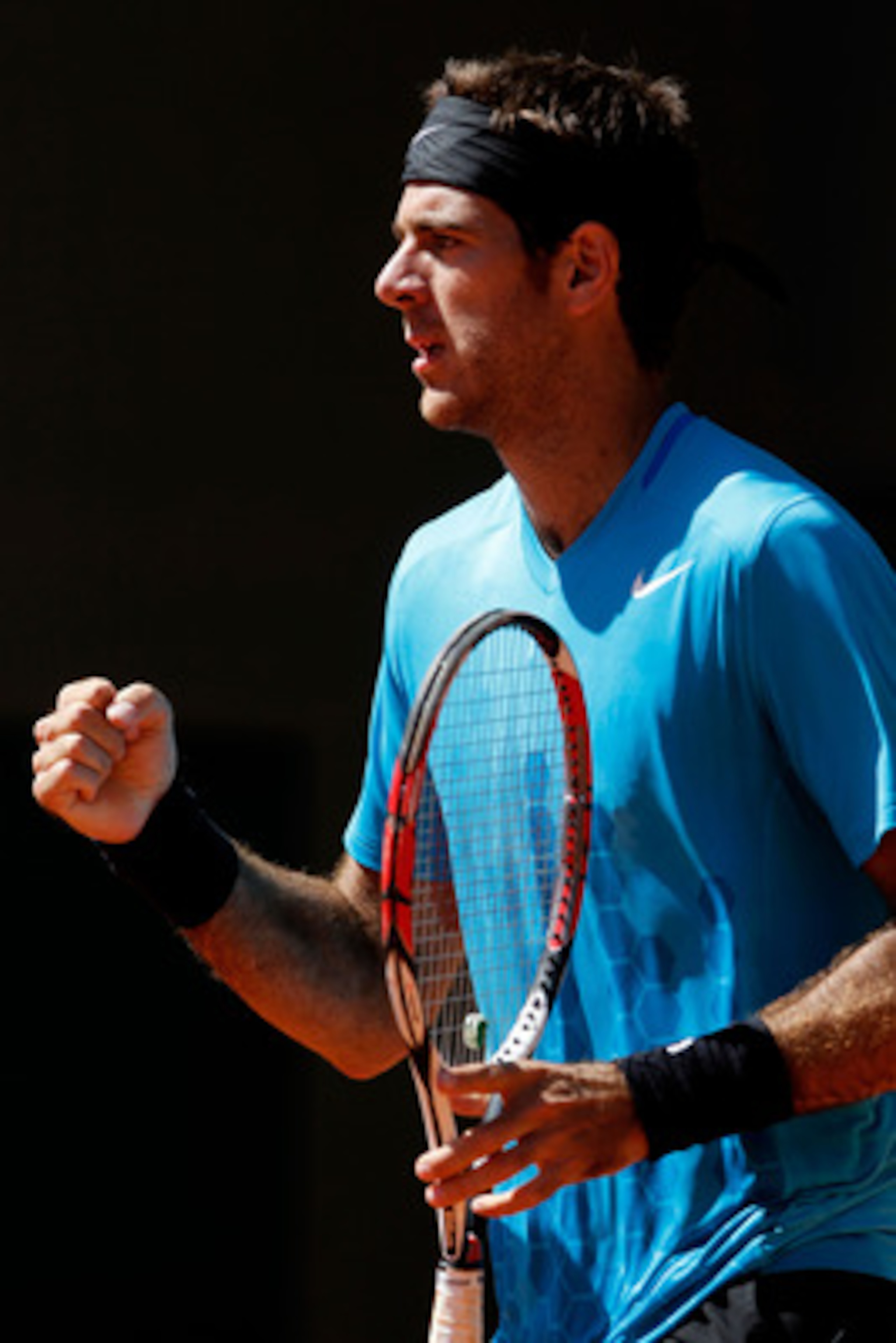 PARIS, FRANCE - MAY 25:  Juan Martin Del Potro of Argentina celebrates a point during the men's singles round two match between Juan Martin Del Potro of Argentina and Blaz Kavcic Slovenia on day four of the French Open at Roland Garros on May 25, 2011 in