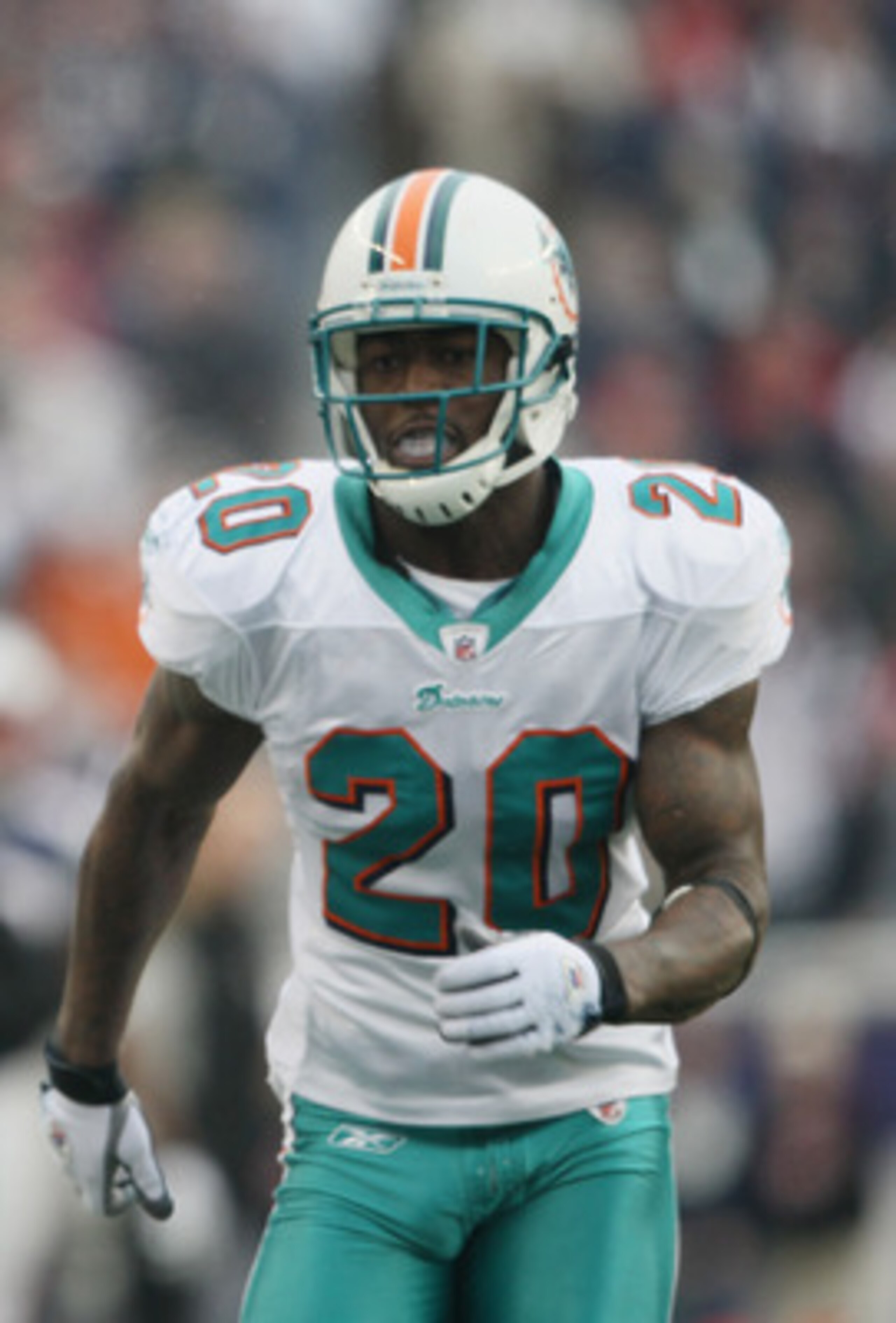 FOXBORO, MA - JANUARY 02:  Brandon Tate #19 of the New England Patriots carries the ball as Reshad Jones #20 of the Miami Dolphins chases after him on January 2, 2011 at Gillette Stadium in Foxboro, Massachusetts.  (Photo by Elsa/Getty Images)
