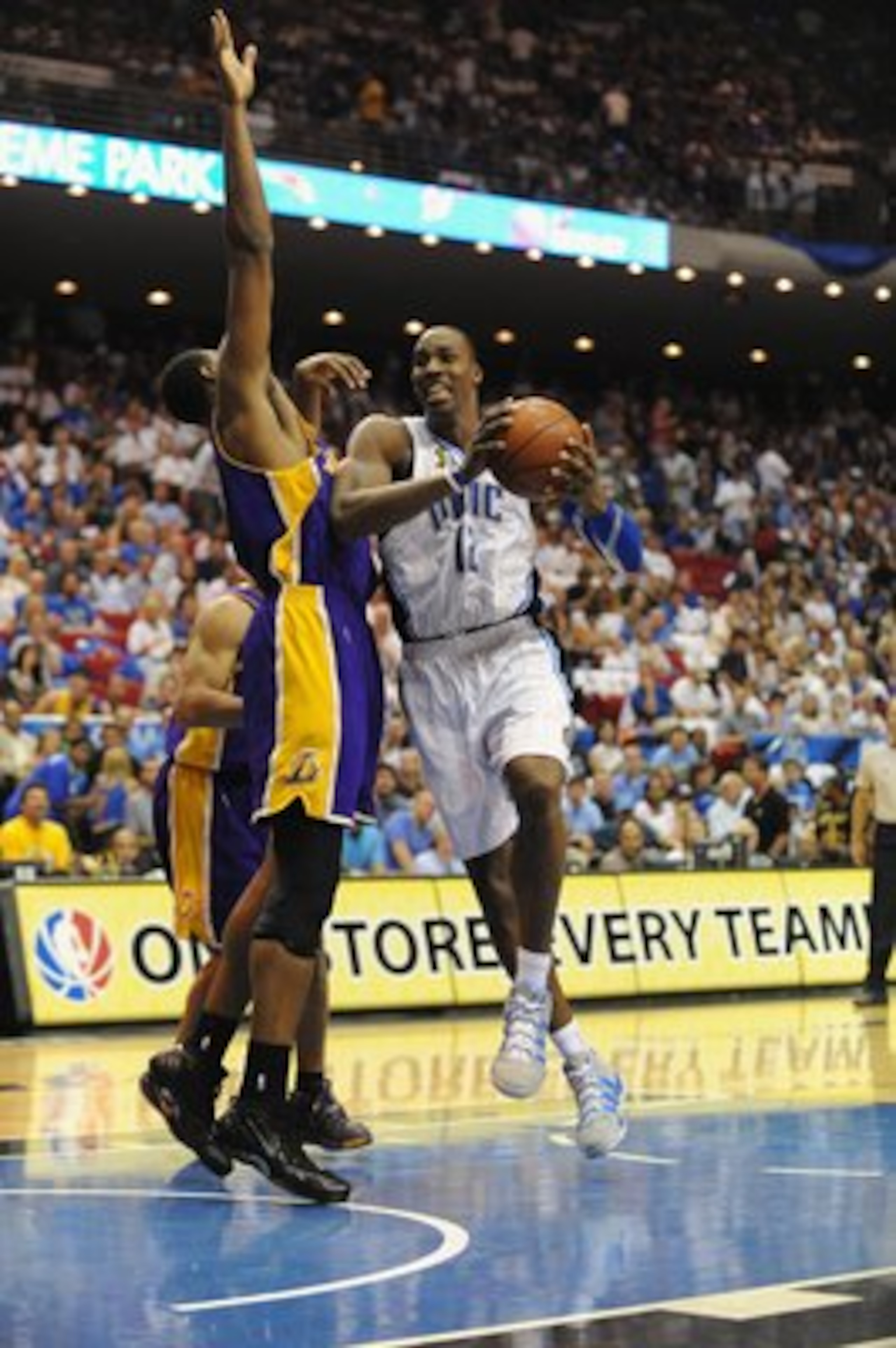 ORLANDO, FL - JUNE 14:  Dwight Howard #12 of the Orlando Magic moves through the lane against Andrew Bynum #17 of the Los Angeles Lakers in Game Five of the 2009 NBA Finals on June 14, 2009 at Amway Arena in Orlando, Florida. The Lakers won 99-86.  NOTE T