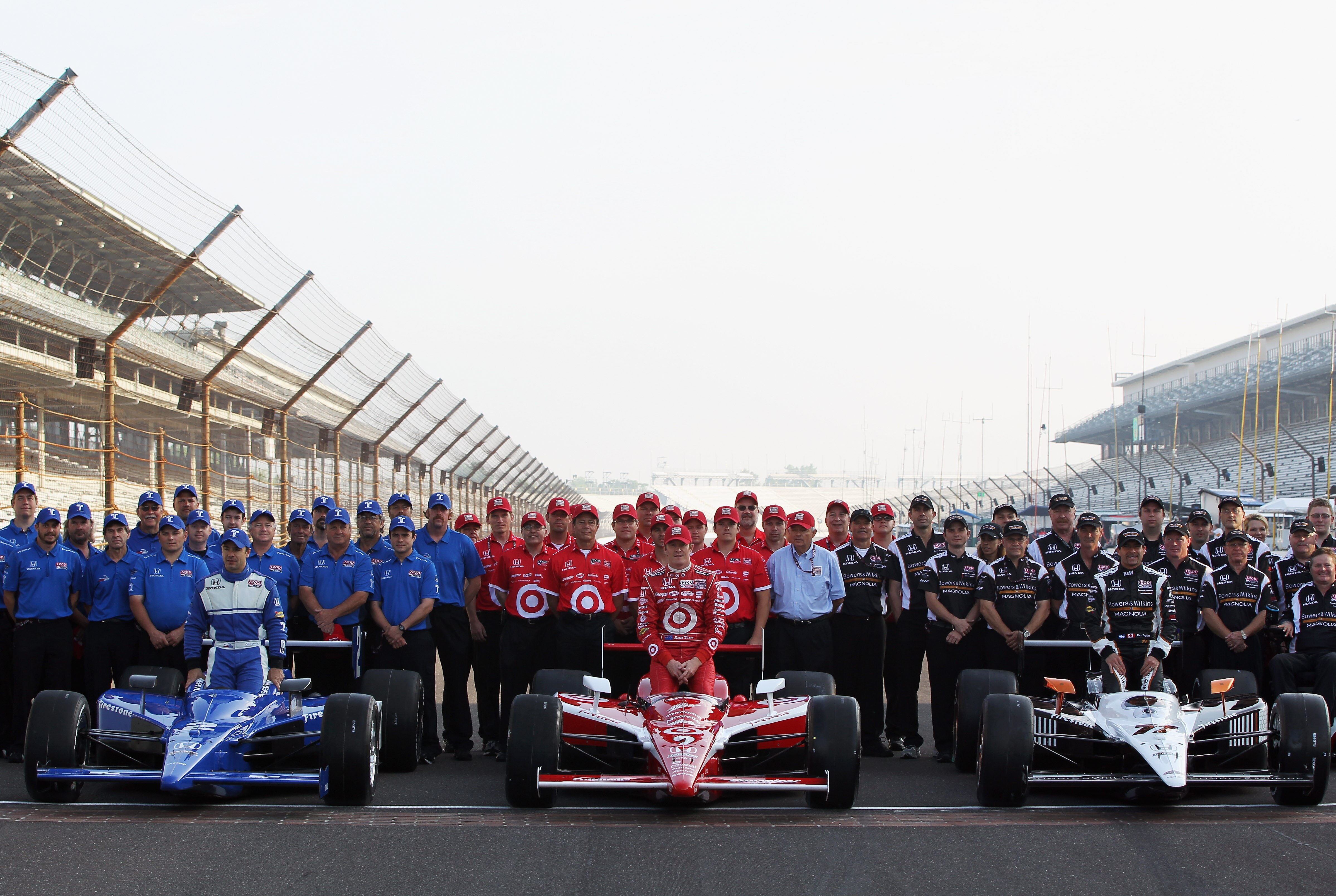 INDIANAPOLIS, IN - MAY 22:  Polesitter Alex Tagliani of Canada, driver of the #77 Bowers & Wilkins/Sam Schmidt Motorsports Dallara Honda, poses on the finish line alongside Scott Dixon of New Zealand, driver of the #9 Target Chip Ganassi Racing Dallara Ho