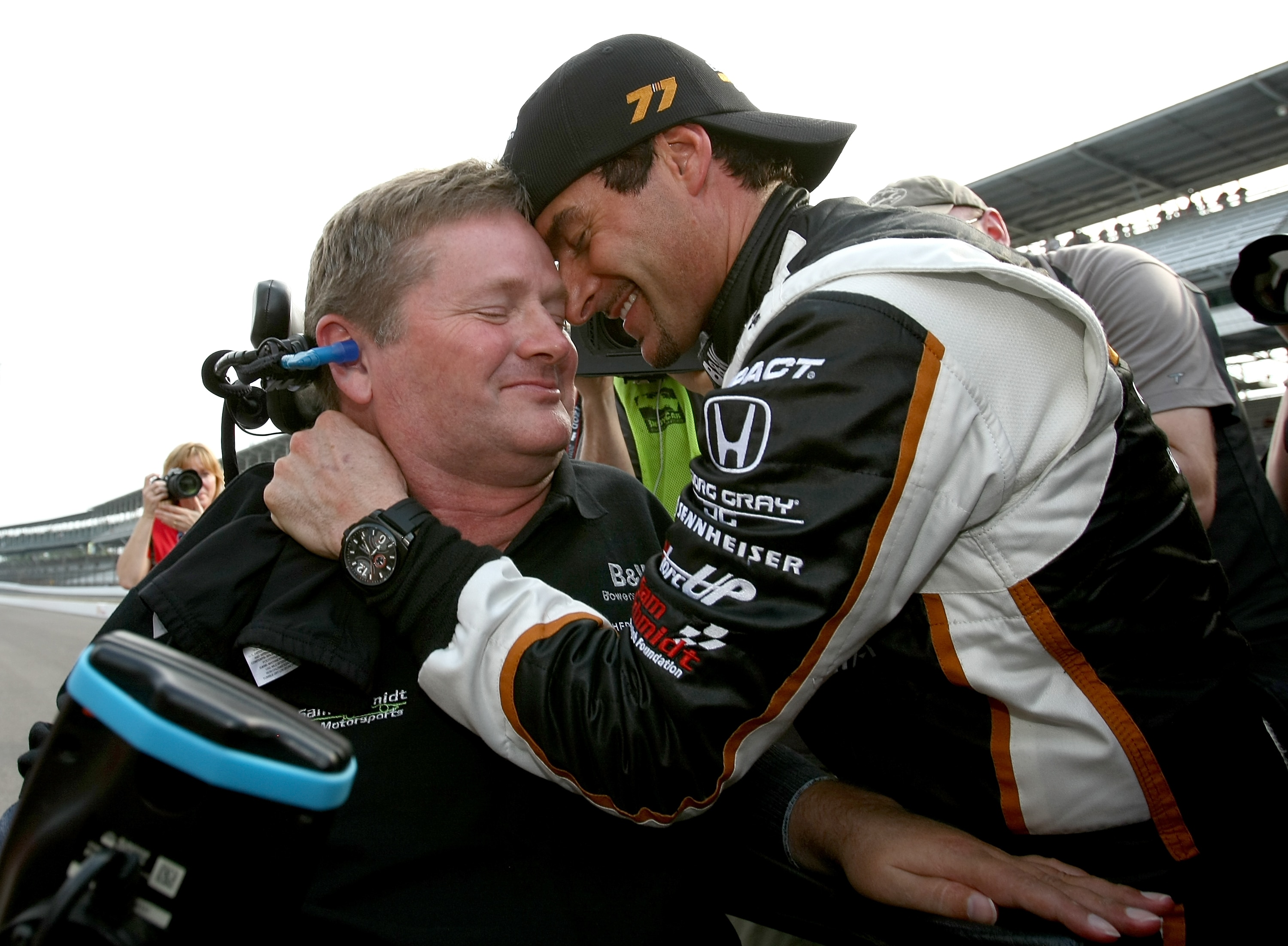 INDIANAPOLIS - MAY 21:  Alex Tagliani driver of the #77 Bowers & Wilkens/Sam Schmidt Motorsports Dallara Honda celebrates winning the pole position with team owner sam Schmidt during qualifying for the the 95th Indianapolis 500 Mile Race at the Indianapol