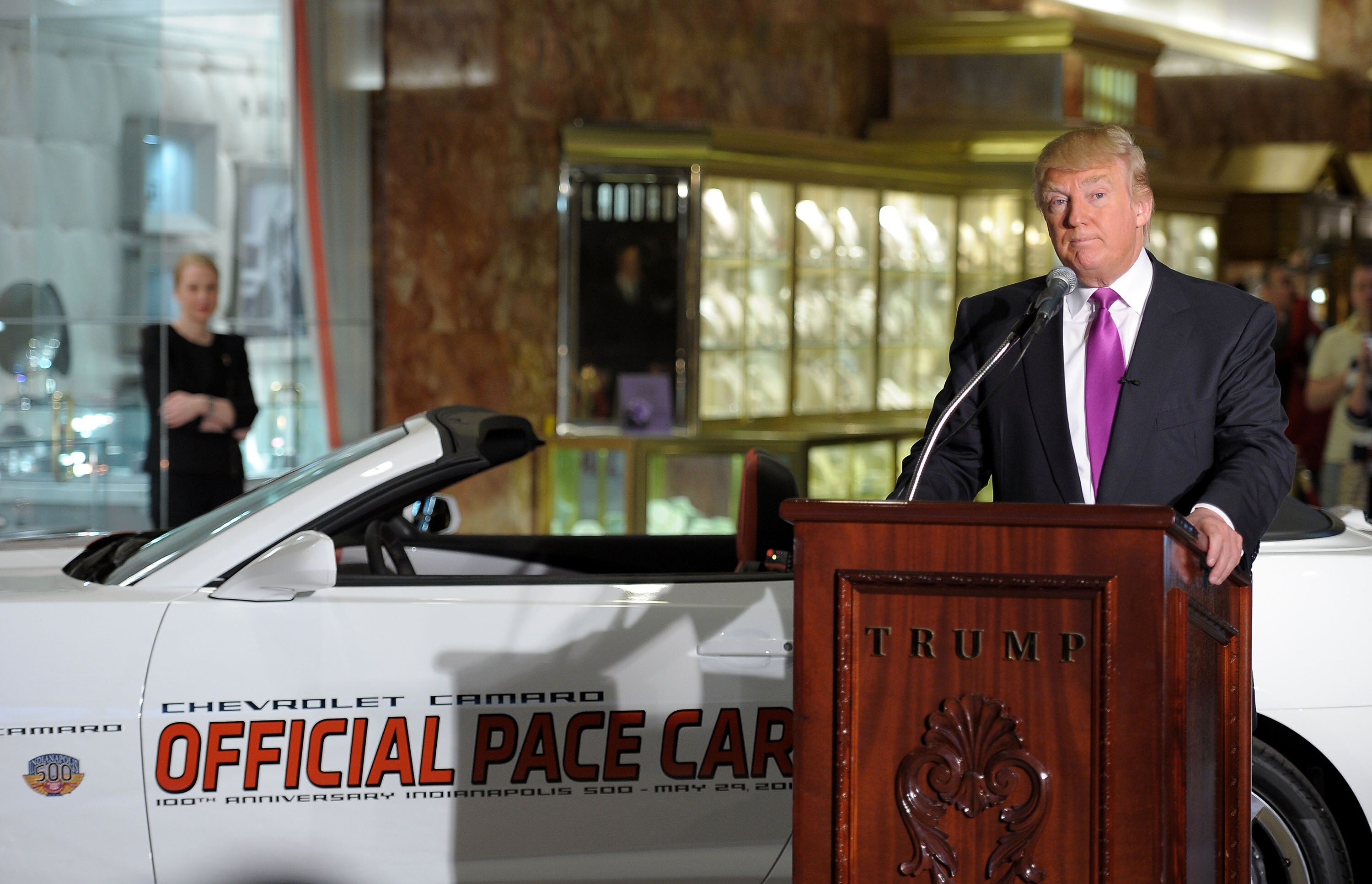 NEW YORK, NY - APRIL 05:  Donald Trump checks out his new ride as the 2011 Indianapolis 500 Chevrolet Camaro SS Convertible Pace Car driver for the 100th Anniversary of the Indianapolis 500 at Trump Tower on April 5, 2011 in New York City. Trump will lead