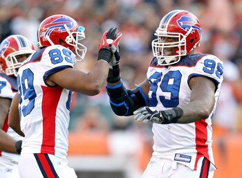 CINCINNATI - NOVEMBER 21:  Marcus Stroud #99 and Shawn Nelson #89 of the Buffalo Bills celebrate during NFL game against the Cincinnati Bengals at Paul Brown Stadium on November 21, 2010 in Cincinnati, Ohio. The Bills won 49-21.  (Photo by Andy Lyons/Gett