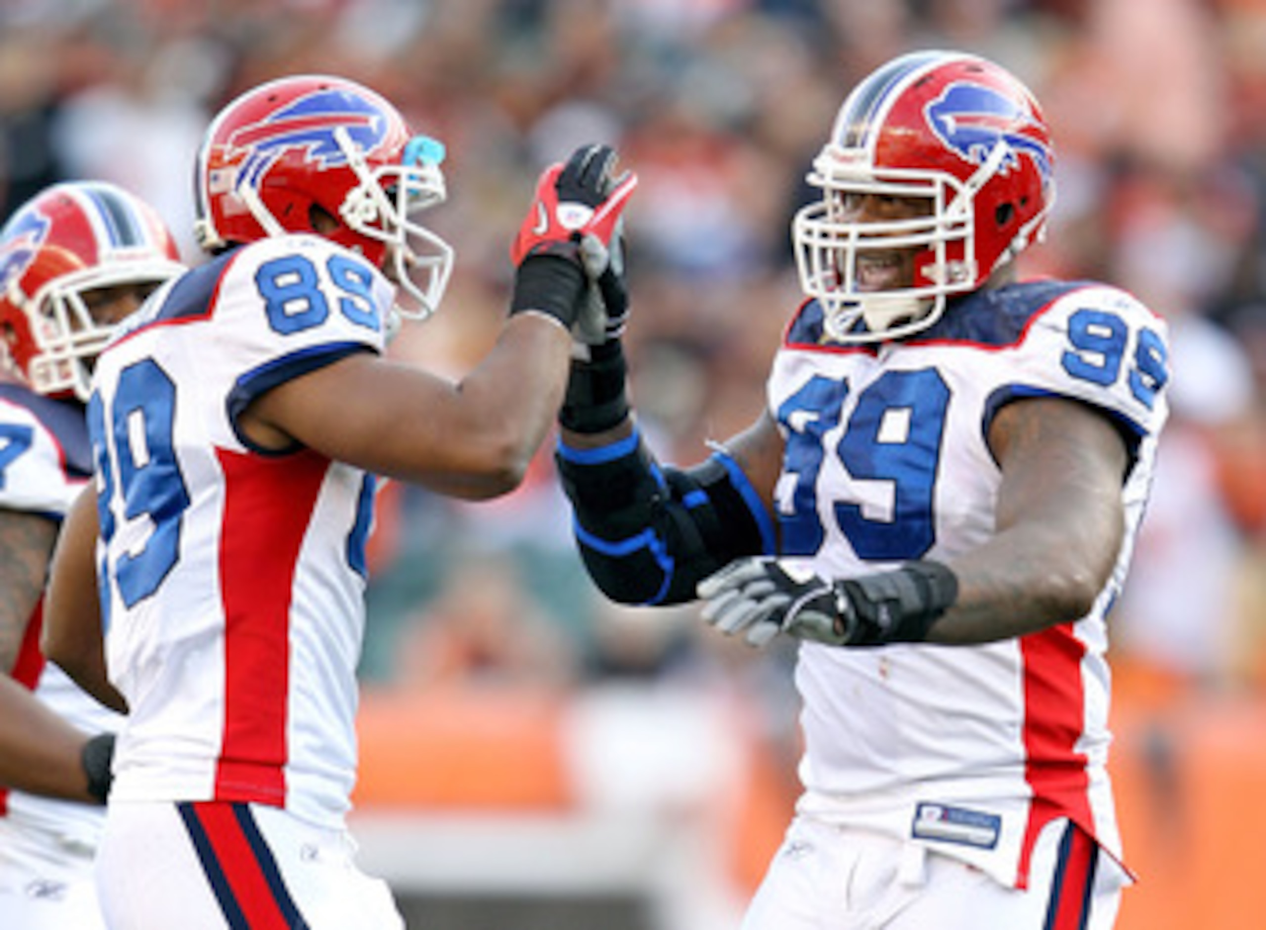 CINCINNATI - NOVEMBER 21:  Marcus Stroud #99 and Shawn Nelson #89 of the Buffalo Bills celebrate during NFL game against the Cincinnati Bengals at Paul Brown Stadium on November 21, 2010 in Cincinnati, Ohio. The Bills won 49-21.  (Photo by Andy Lyons/Gett