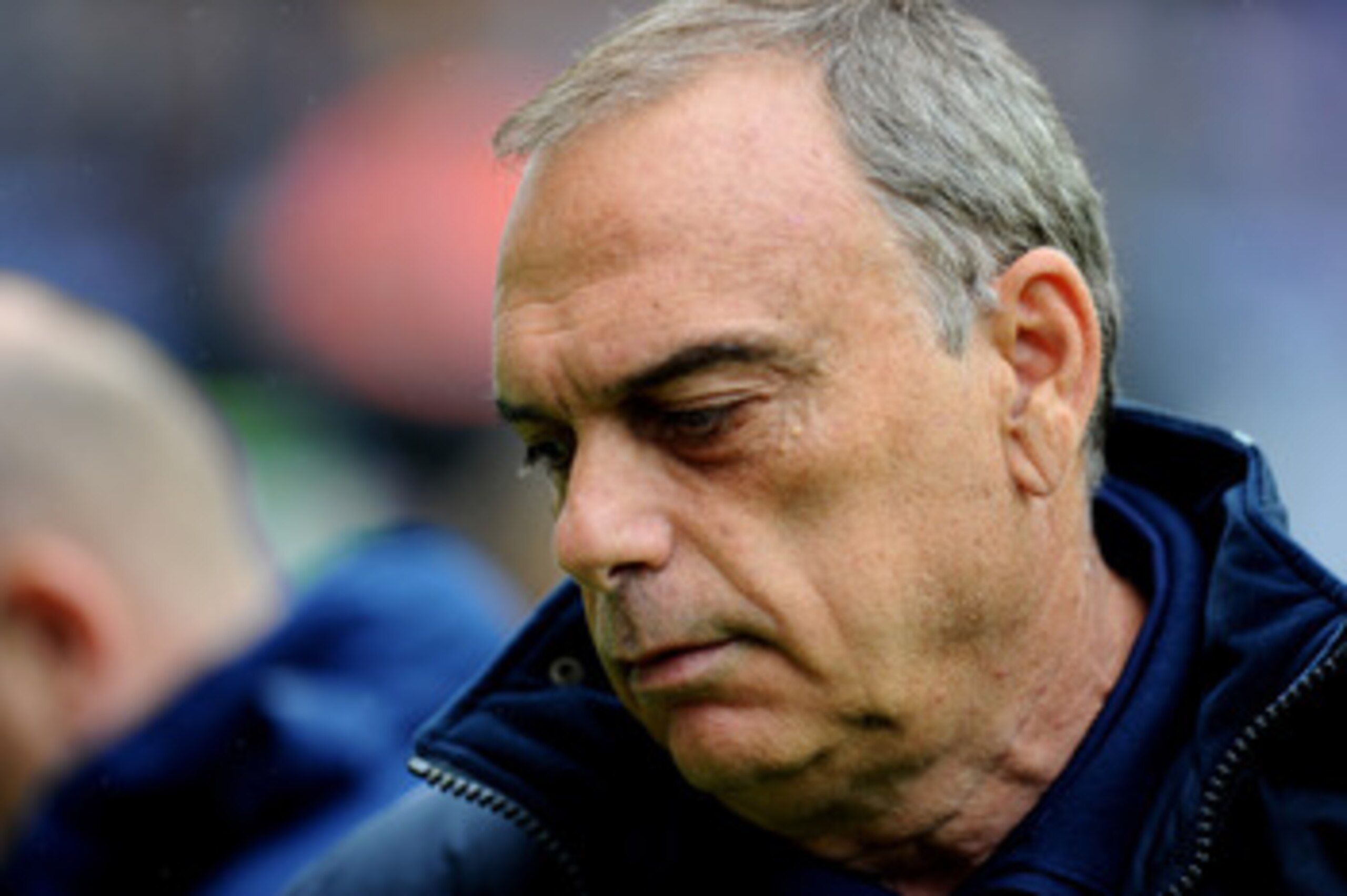 WIGAN, ENGLAND - MAY 15:  West Ham United Manager Avram Grant looks on prior to the Barclays Premier League match between Wigan Athletic and West Ham United at the DW Stadium on May 15, 2011 in Wigan, England.  (Photo by Clive Mason/Getty Images)