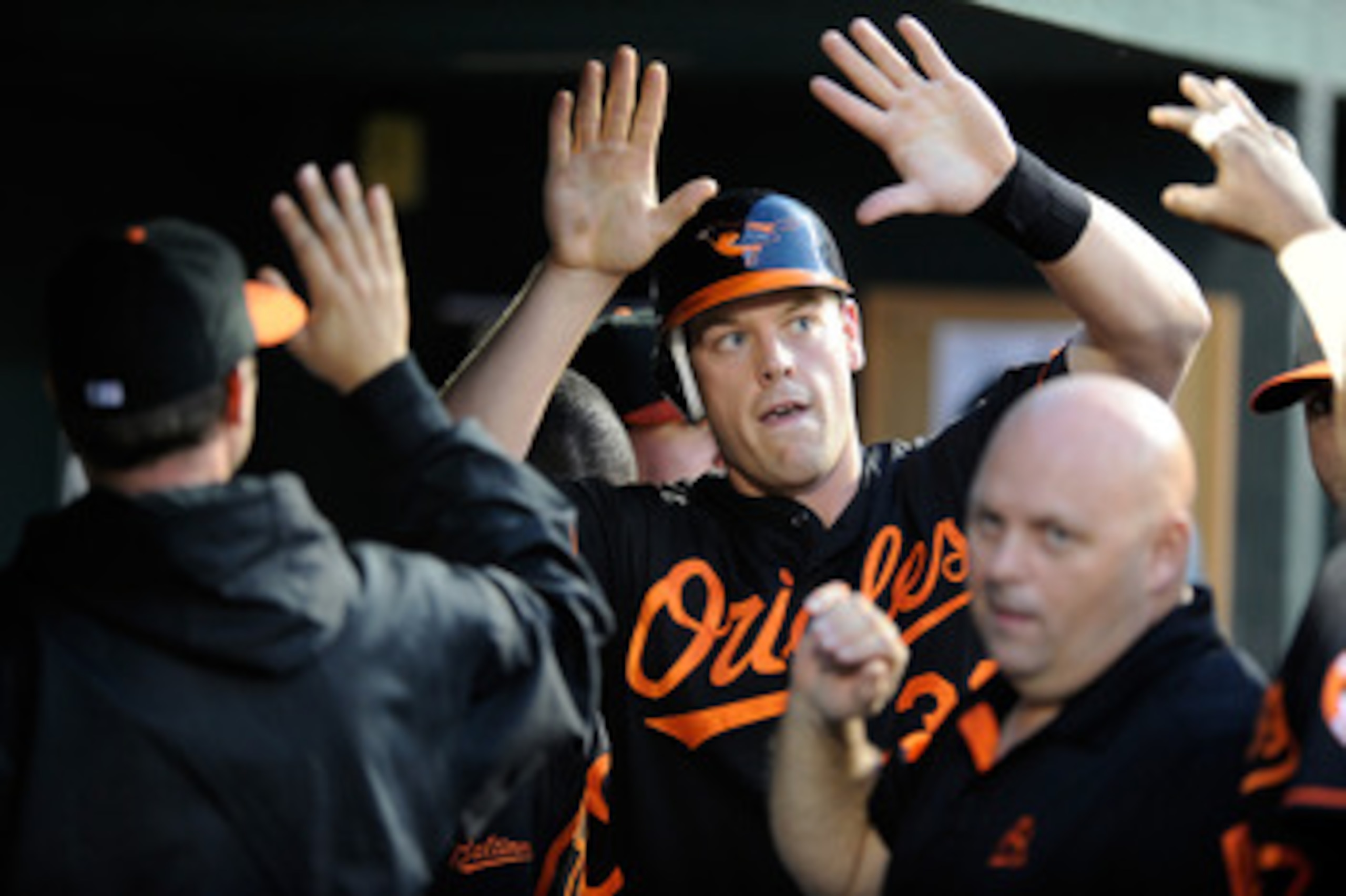 BALTIMORE, MD - MAY 20:  Matt Wieters #32 of the Baltimore Orioles celebrates with teammates after scoring in the third inning against the Washington Nationals at Oriole Park at Camden Yards on May 20, 2011 in Baltimore, Maryland.  (Photo by Greg Fiume/Ge