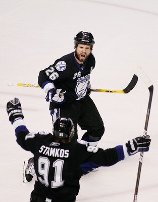 TAMPA, FL - MAY 25:  Martin St. Louis #26 celebrates his second period goal with Steven Stamkos #91 of the Tampa Bay Lightning in Game Six of the Eastern Conference Finals against the Boston Bruins during the 2011 NHL Stanley Cup Playoffs at St Pete Times