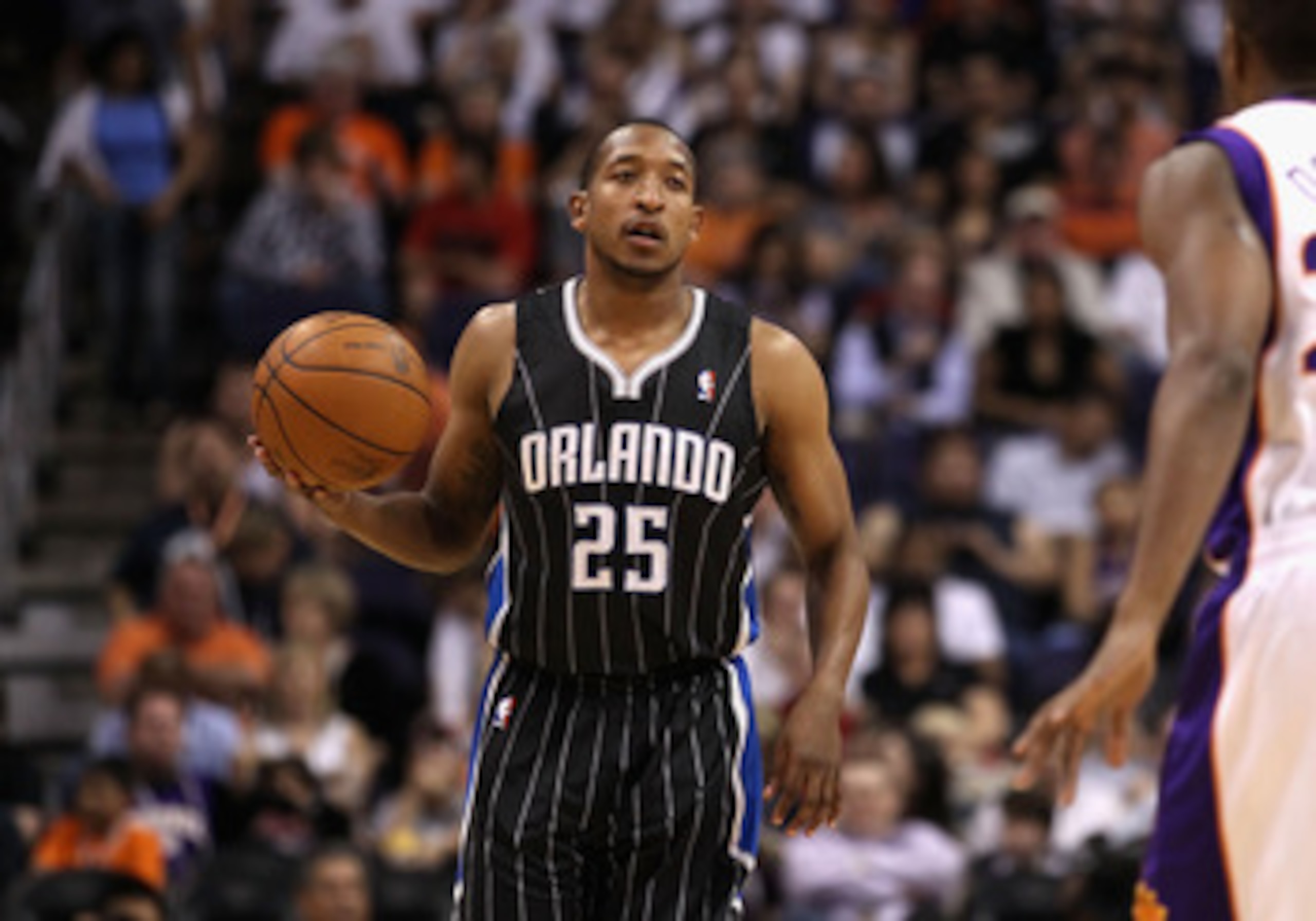 PHOENIX, AZ - MARCH 13:  Chris Duhon #25 of the Orlando Magic during the NBA game against the Phoenix Suns at US Airways Center on March 13, 2011 in Phoenix, Arizona.  NOTE TO USER: User expressly acknowledges and agrees that, by downloading and or using