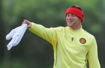 MANCHESTER, ENGLAND - MAY 24:  Wayne Rooney of Manchester United looks on during the Manchester United training session ahead of the UEFA Champions League Final against Barcelona at the Carrington Training Ground on May 24, 2011 in Manchester, England.  (
