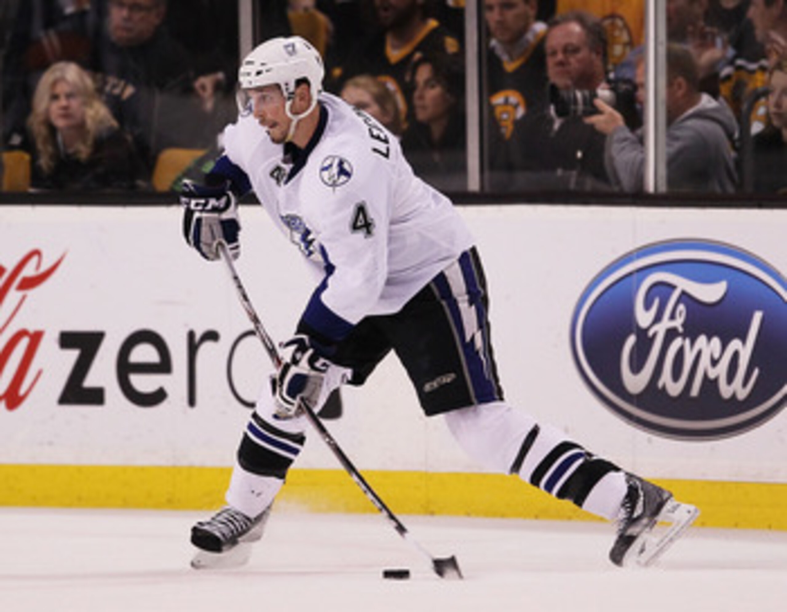 BOSTON, MA - MAY 23:  Vincent Lecavalier #4 of the Tampa Bay Lightning controls the puck in Game Five of the Eastern Conference Finals against the Boston Bruins during the 2011 NHL Stanley Cup Playoffs at TD Garden on May 23, 2011 in Boston, Massachusetts