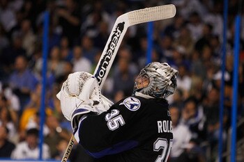 TAMPA, FL - MAY 25:  Dwayne Roloson #35 of the Tampa Bay Lightning celebrates defeating the Boston Bruins 5 to 4 in Game Six of the Eastern Conference Finals during the 2011 NHL Stanley Cup Playoffs at St Pete Times Forum on May 25, 2011 in Tampa, Florida