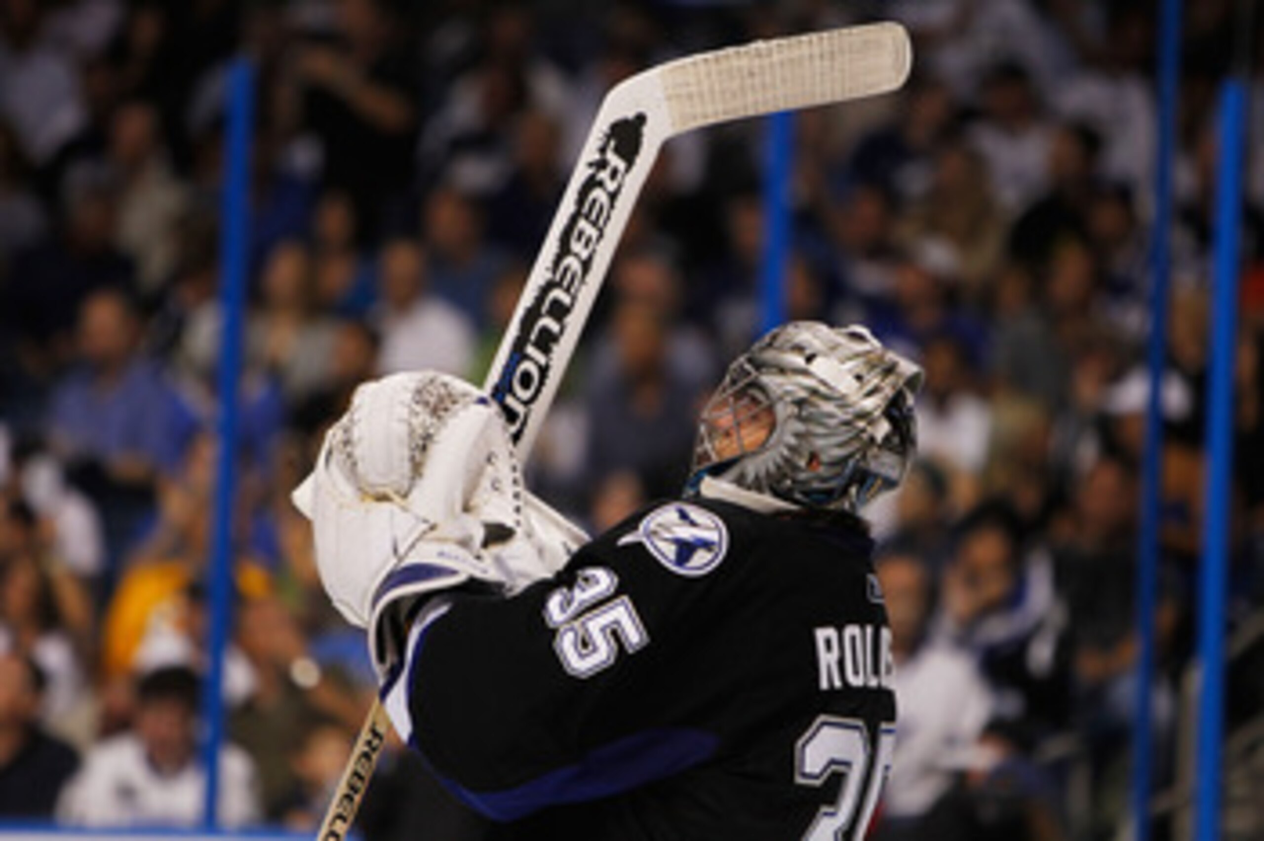 TAMPA, FL - MAY 25:  Dwayne Roloson #35 of the Tampa Bay Lightning celebrates defeating the Boston Bruins 5 to 4 in Game Six of the Eastern Conference Finals during the 2011 NHL Stanley Cup Playoffs at St Pete Times Forum on May 25, 2011 in Tampa, Florida