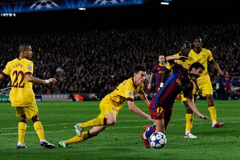 BARCELONA, SPAIN - MARCH 08:  Laurent Koscielny of Arsenal brings down Pedro Rodriguez of FC Barcelona to concede a penalty during the UEFA Champions League round of 16 second leg match between Barcelona and Arsenal at the Camp Nou stadium on March 8, 201
