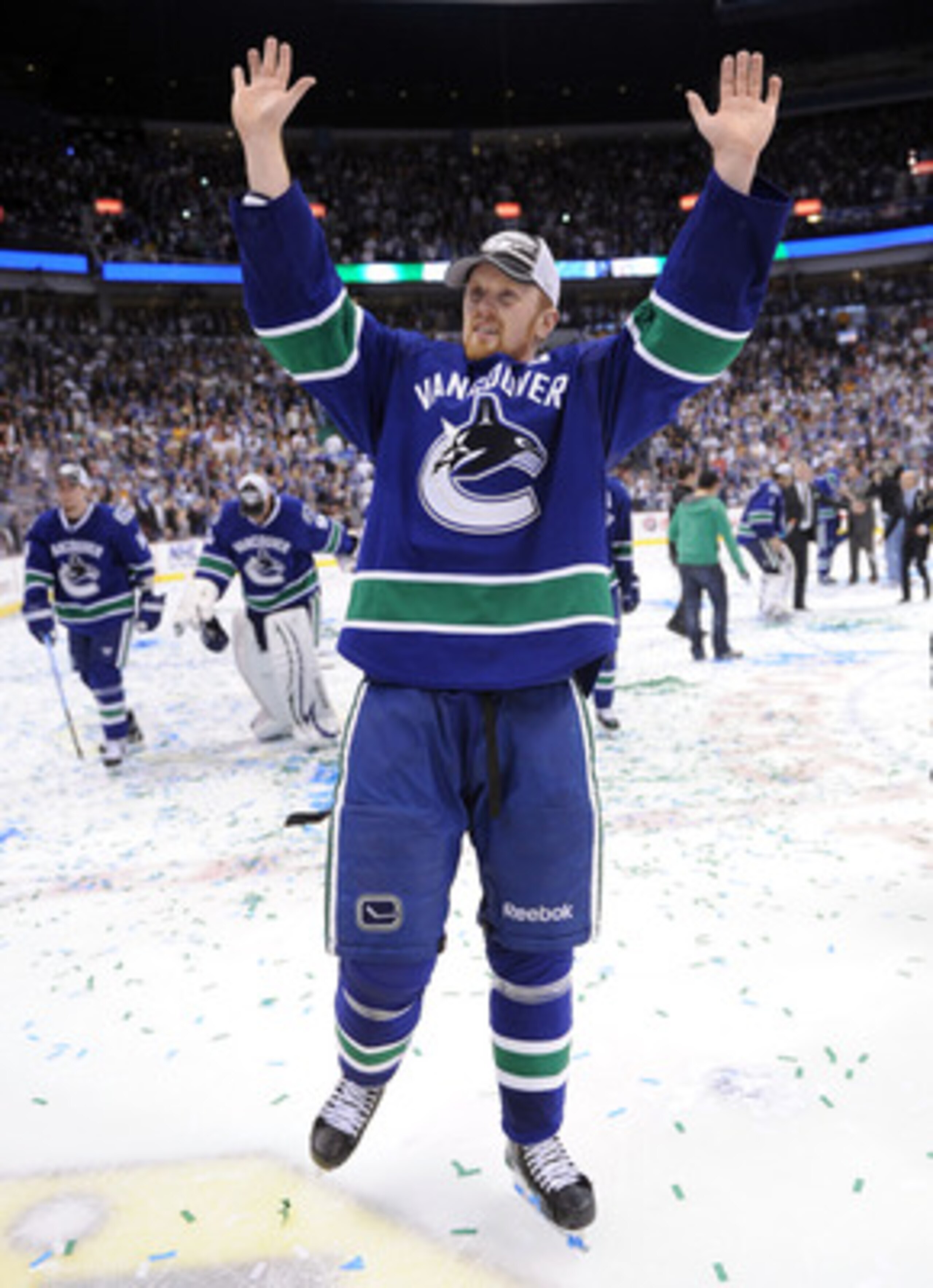 VANCOUVER, CANADA - MAY 24:  Henrik Sedin #33 of the Vancouver Canucks celebrates after defeating the San Jose Sharks 3-2 in double-overtime in Game Five to win the Western Conference Finals during the 2011 Stanley Cup Playoffs at Rogers Arena on May 24,