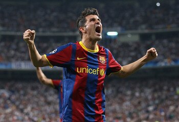 MADRID, SPAIN - APRIL 27:  David Villa of Barcelona celebrates after Lionel Messi scores the opening goal during the UEFA Champions League Semi Final first leg match between Real Madrid and Barcelona at Estadio Santiago Bernabeu on April 27, 2011 in Madri
