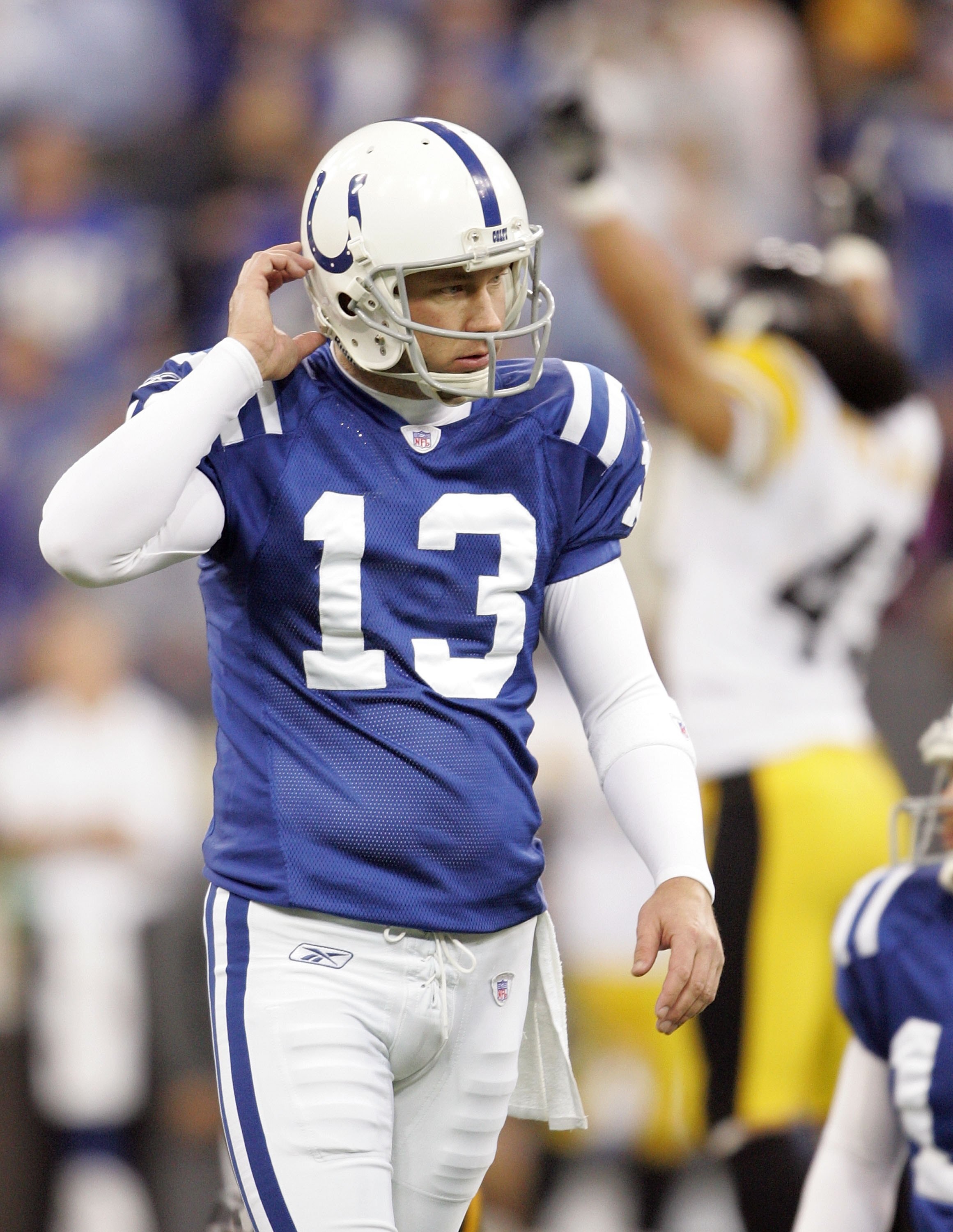 INDIANAPOLIS - JANUARY 15:  Kicker Mike Vanderjagt #13 of the Inidanapolis Colts walks off the field dejected after he missed the potential game-tying filed goal against the Pittsburgh Steelers during the AFC Divisional Playoffs January 15, 2006 at the RC
