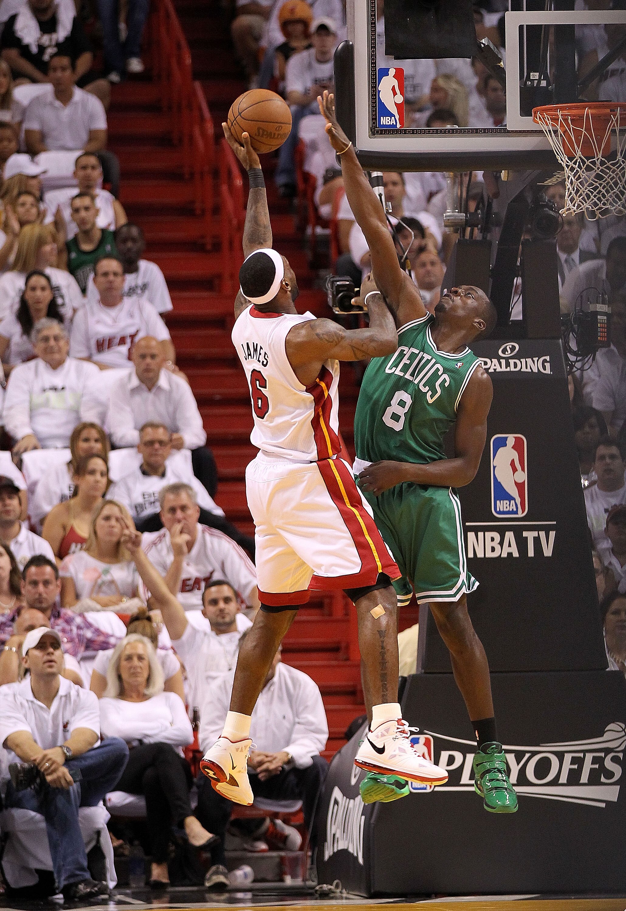 MIAMI, FL - MAY 11: LeBron James #6 of the Miami Heat shoots over Jeff Green #8 of the Boston Celtics during Game Five of the Eastern Conference Semifinals of the 2011 NBA Playoffs at American Airlines Arena on May 11, 2011 in Miami, Florida. NOTE TO USER