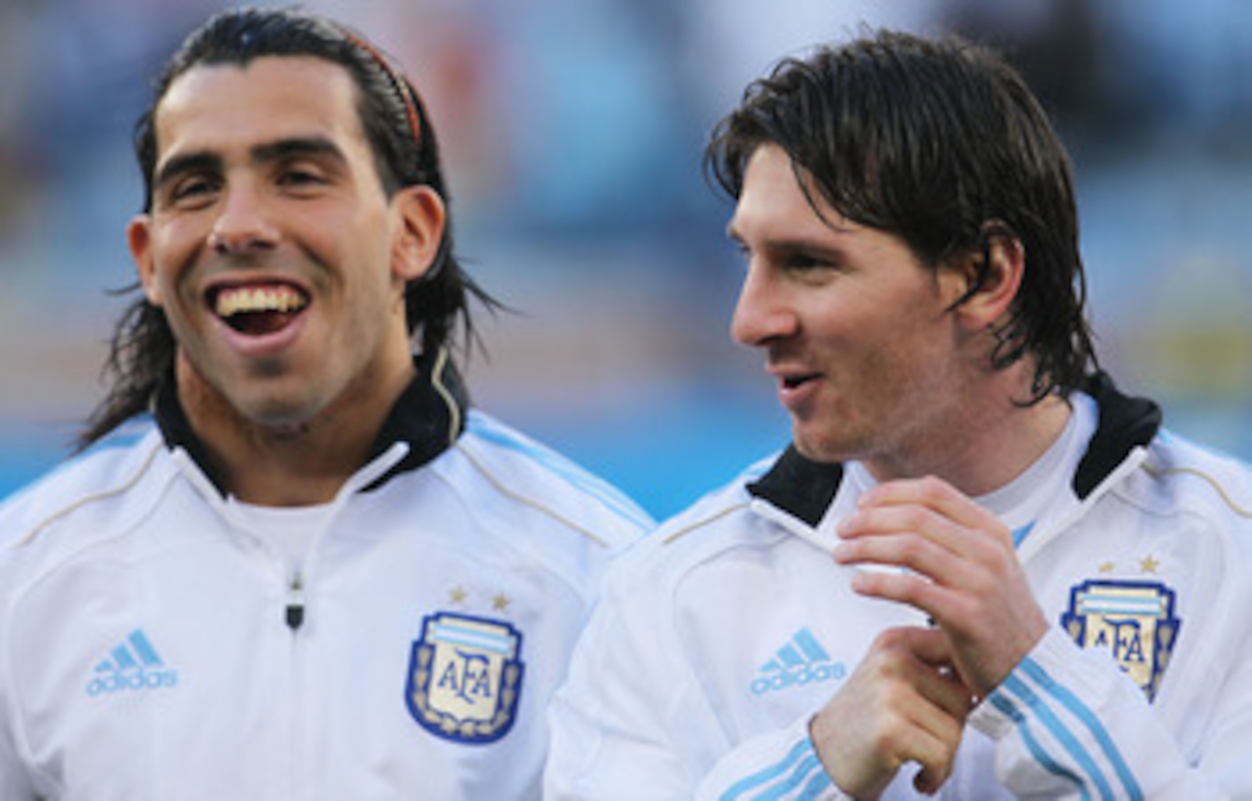 CAPE TOWN, SOUTH AFRICA - JULY 03: Carlos Tevez and Lionel Messi of Argentina share a joke ahead of the 2010 FIFA World Cup South Africa Quarter Final match between Argentina and Germany at Green Point Stadium on July 3, 2010 in Cape Town, South Africa. CAPE TOWN, SOUTH AFRICA - JULY 03: Carlos Tevez and Lionel Messi of Argentina share a joke ahead of the 2010 FIFA World Cup South Africa Quarter Final match between Argentina and Germany at Green Point Stadium on July 3, 2010 in Cape Town, South Africa.