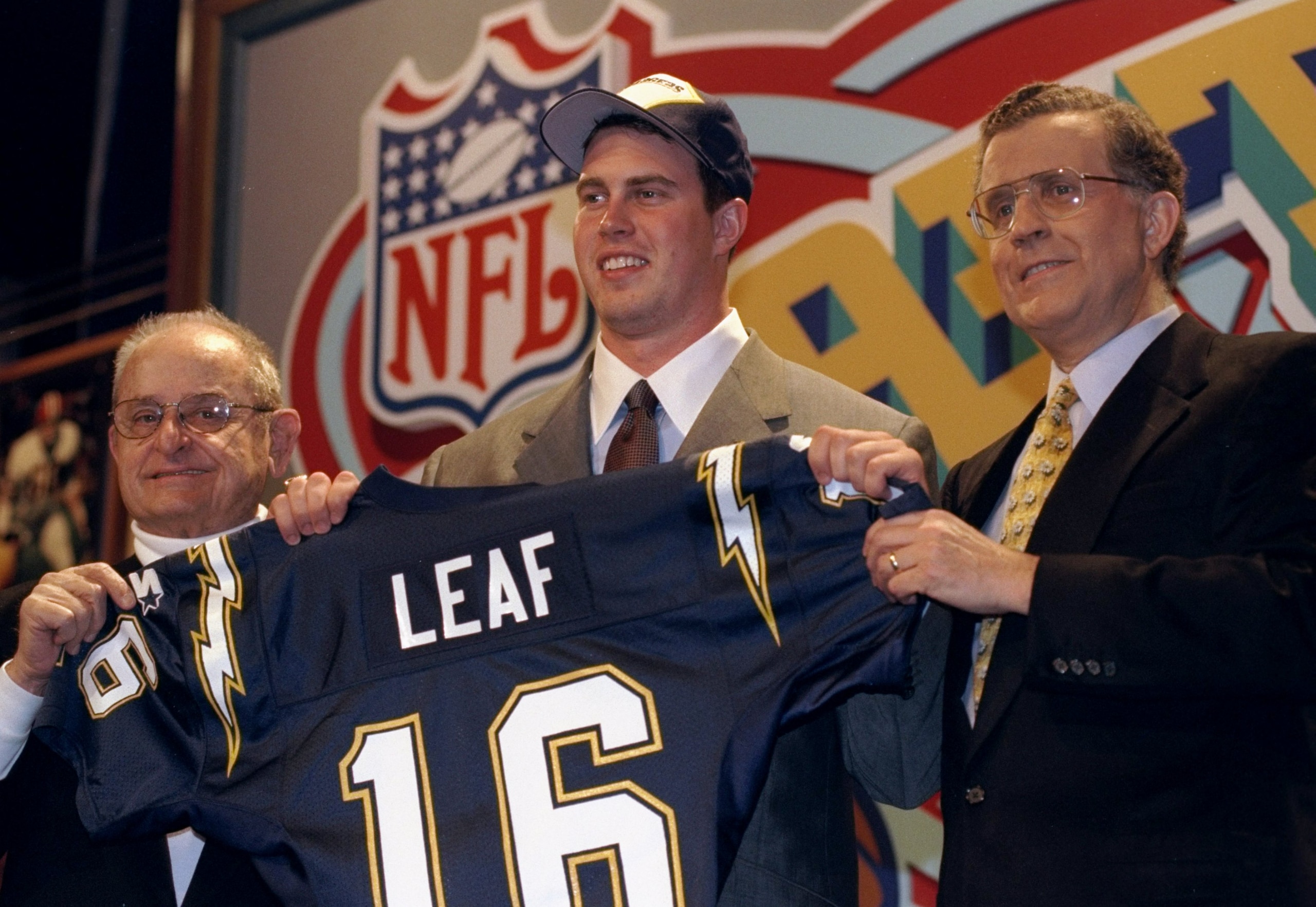 18 Apr 1998:  Second overall pick Ryan Leaf (Center) shows off his jersey alongside Alex Spanos (L) and commissioner Paul Tagliabue (R) after being selected by the San Diego Chargers in the first round of the 1998 NFL Draft at Madison Square Garden in Man
