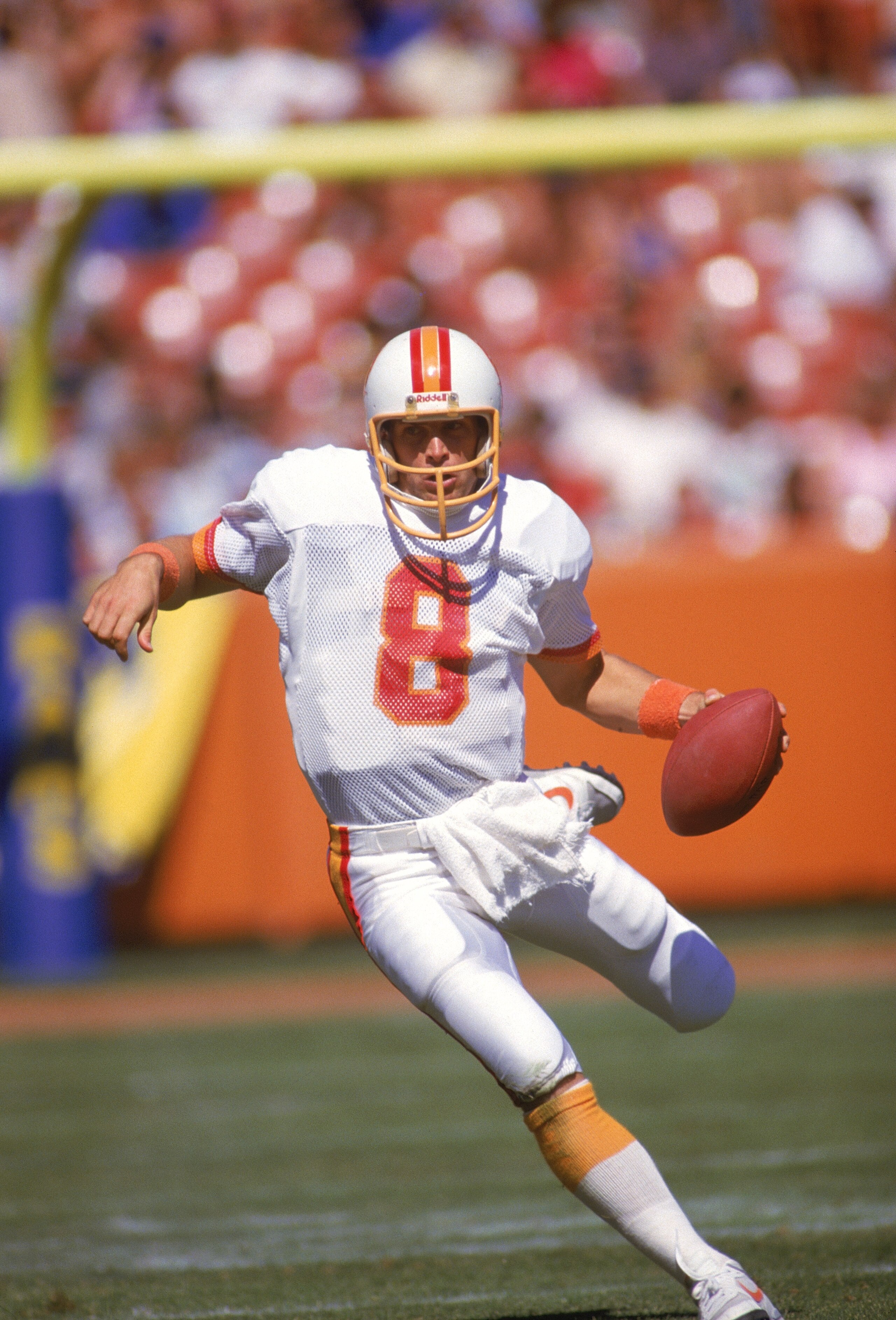 ANAHEIM, CA - OCTOBER 5:  Quarterback Steve Young #8 of the Tampa Bay Buccaneers scrambles against the Los Angeles Rams at Anaheim Stadium on October 5, 1986 in Anaheim, California. The Rams won in overtime 26-20. (Photo by Rick Stewart/Getty Images)
