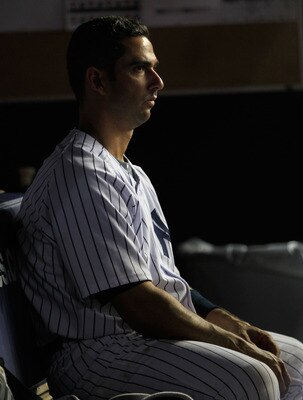 NEW YORK, NY - APRIL 25:  Jorge Posada #20 of the New York Yankees looks on from the dugout during the game against the Chicago White Sox at Yankee Stadium on April 25, 2011 in the Bronx borough of New York City.  (Photo by Chris Trotman/Getty Images)