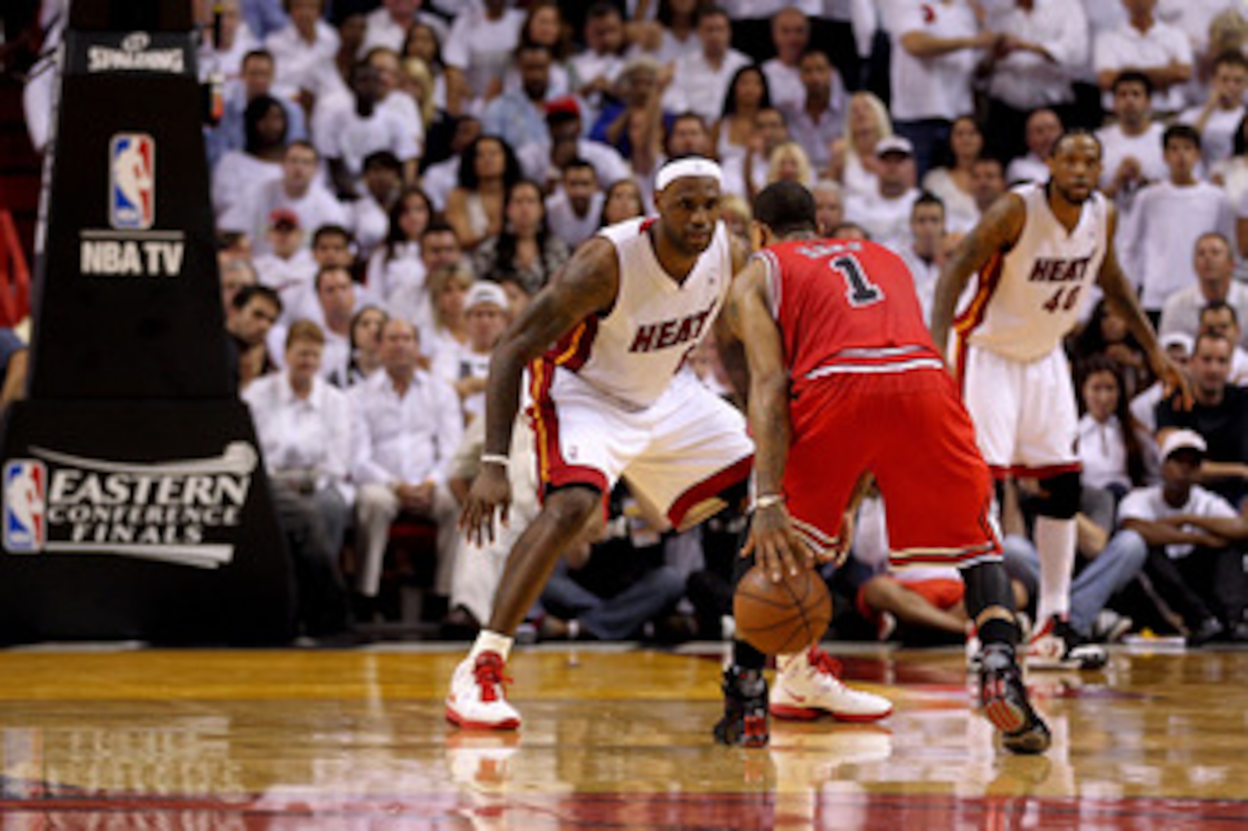 MIAMI, FL - MAY 24:  LeBron James #6 of the Miami Heat defends Derrick Rose #1 of the Chicago Bulls in Game Four of the Eastern Conference Finals during the 2011 NBA Playoffs on May 24, 2011 at American Airlines Arena in Miami, Florida. The Heat won 101-9