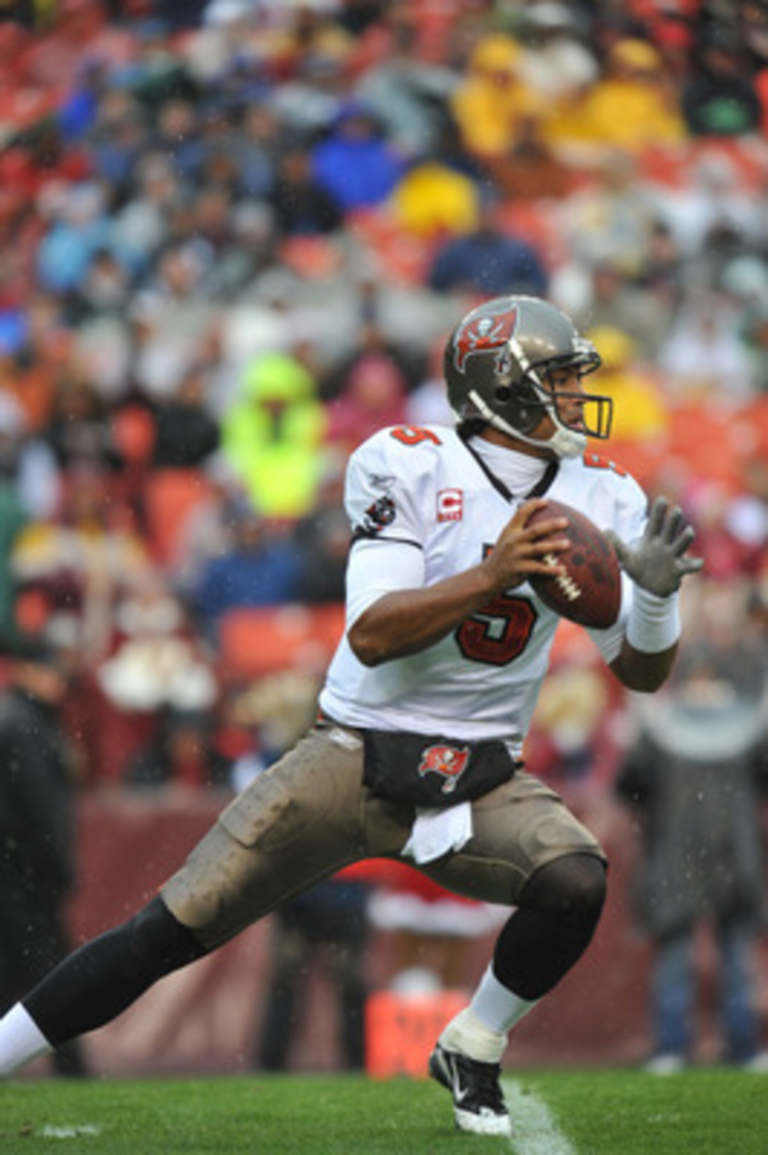 LANDOVER, MD - DECEMBER 12:  Josh Freeman #5 of the Tampa Bay Buccaneers looks for a receiver during the game against the Washington Redskins  at FedExField on December 12, 2010 in Landover, Maryland. The Buccaneers defeated the Redskins 17-16. (Photo by 
