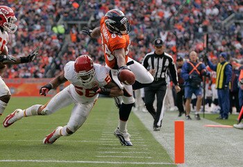 DENVER - NOVEMBER 14:  Wide receiver Demaryius Thomas #88 of the Denver Broncos stretches the ball towards the goal line but is knocked out of bounds by linebacker Derrick Johnson #56 of the Kansas City Chiefs at the 1-yard-line during the second quarter 