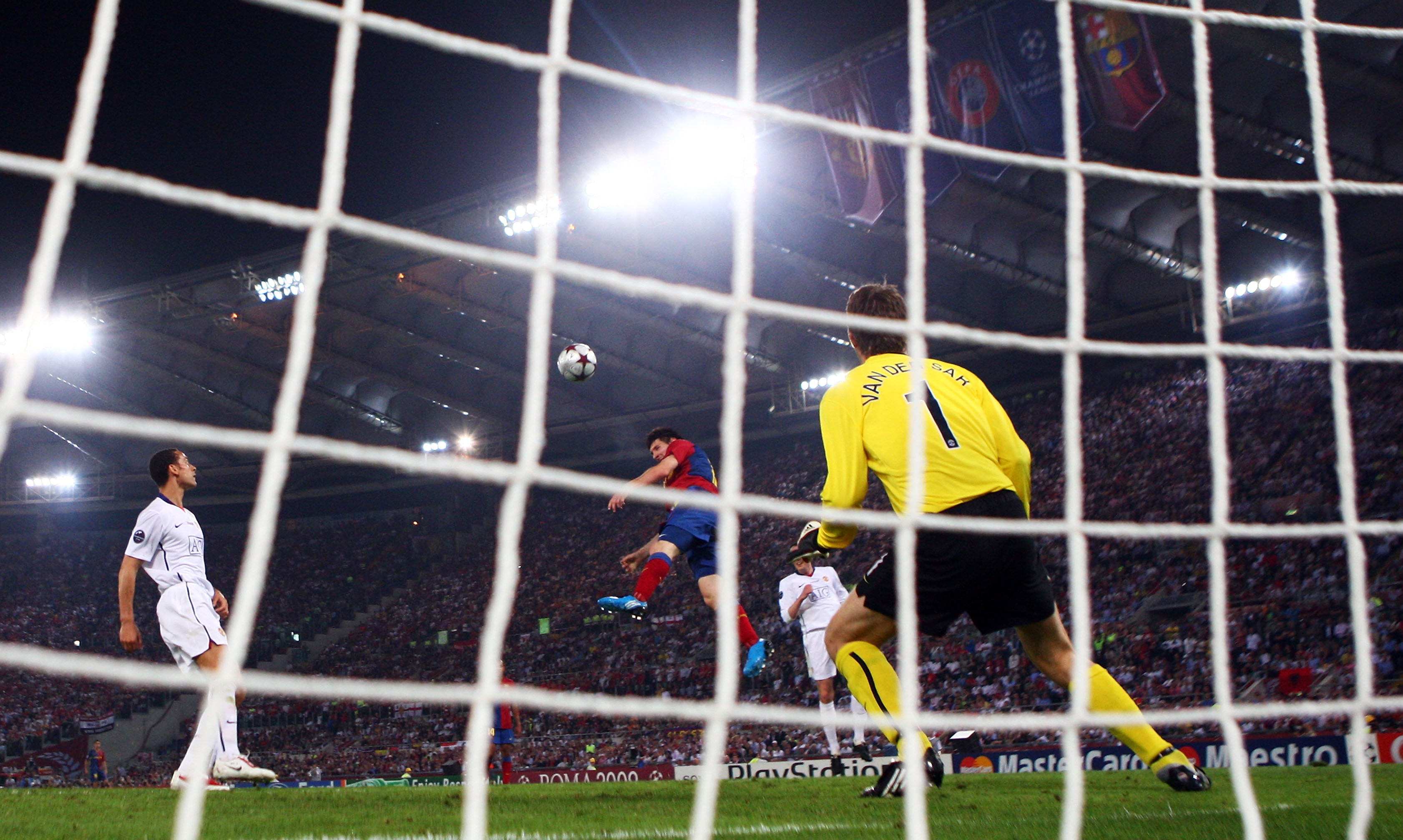 ROME - MAY 27:  Lionel Messi of Barcelona scores past Manchester United goalkeeper Edwin van der Sar during the UEFA Champions League Final match between Barcelona and Manchester United at the Stadio Olimpico on May 27, 2009 in Rome, Italy.  (Photo by Lau