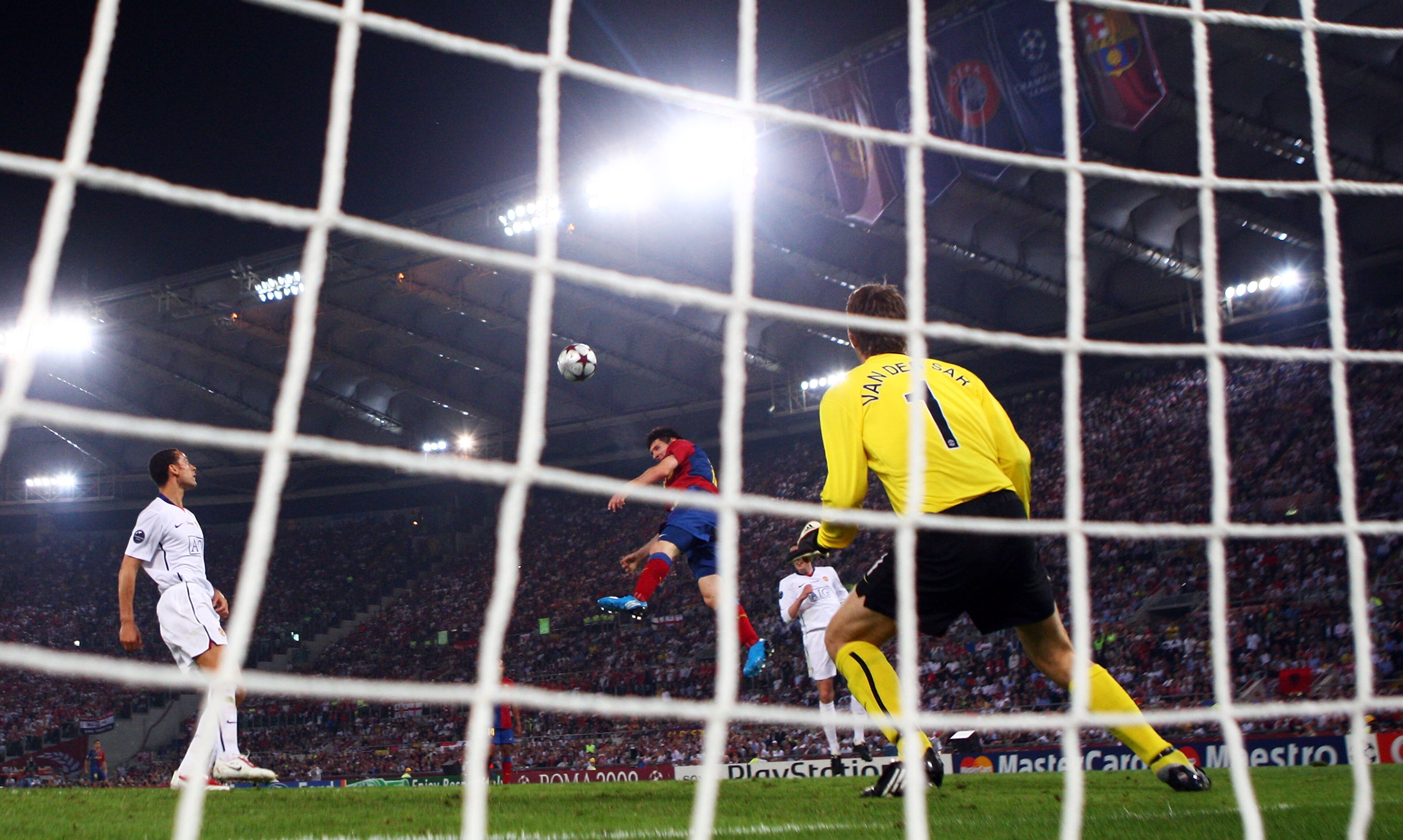 ROME - MAY 27: Lionel Messi of Barcelona scores past Manchester United goalkeeper Edwin van der Sar during the UEFA Champions League Final match between Barcelona and Manchester United at the Stadio Olimpico on May 27, 2009 in Rome, Italy. (Photo by Lau ROME - MAY 27: Lionel Messi of Barcelona scores past Manchester United goalkeeper Edwin van der Sar during the UEFA Champions League Final match between Barcelona and Manchester United at the Stadio Olimpico on May 27, 2009 in Rome, Italy. (Photo by Lau