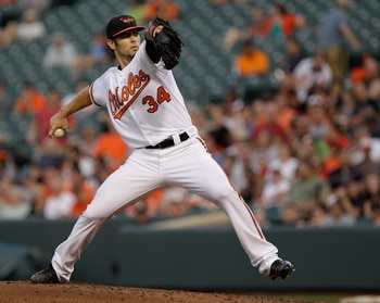 BALTIMORE, MD - MAY 25: Starting pitcher Jake Arrieta #34 of the Baltimore Orioles delivers to a Kansas City Royals batter during the second inning at Oriole Park at Camden Yards on May 25, 2011 in Baltimore, Maryland.  (Photo by Rob Carr/Getty Images)