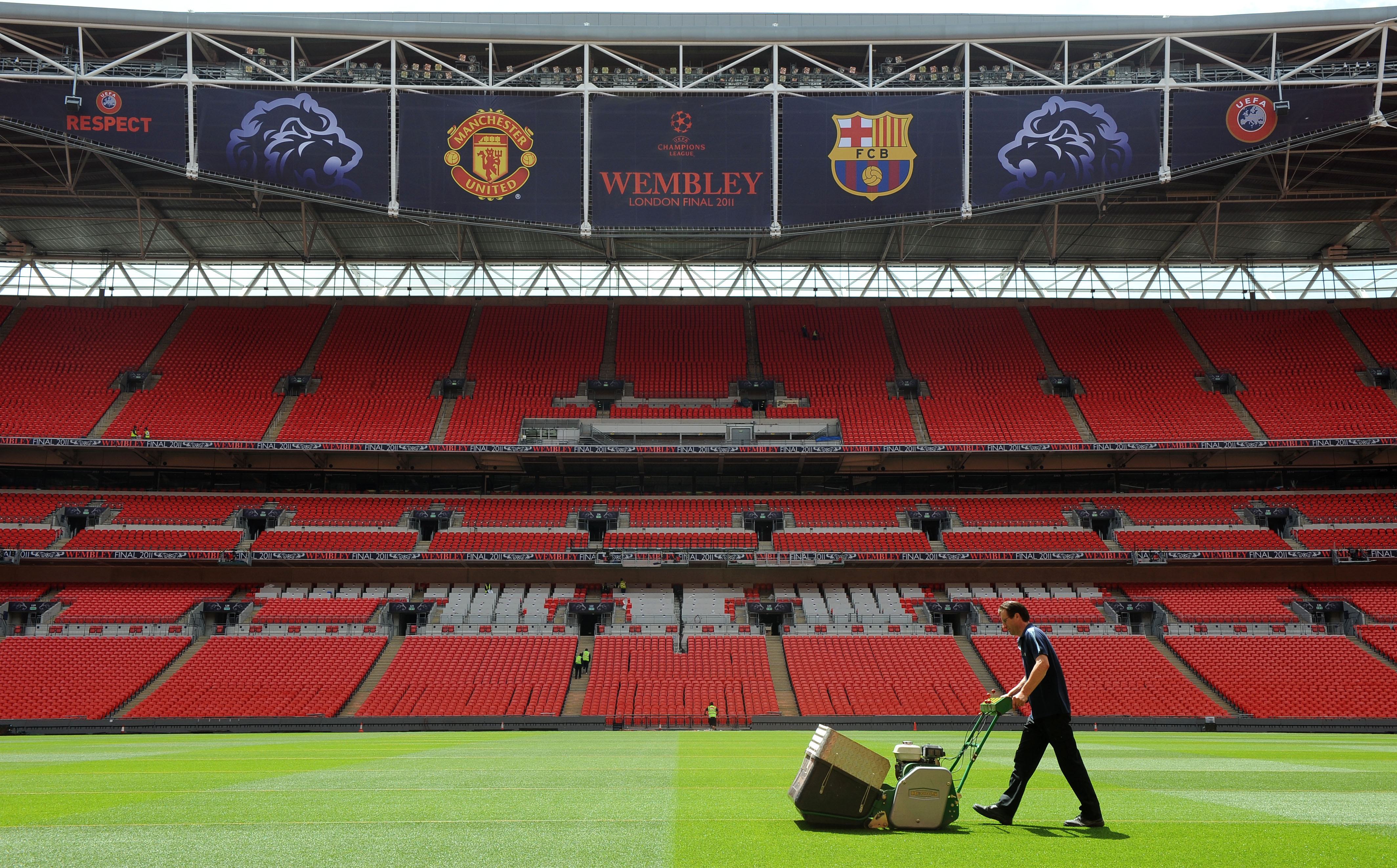 LONDON, UNITED KINGDOM - MAY 24:  In this handout image provided by UEFA, final preparations are made to the pitch at Wembley Stadium for the Champions League Final, May 24, 2011  in London, England. The UEFA Champions League final between FC Barcelona an