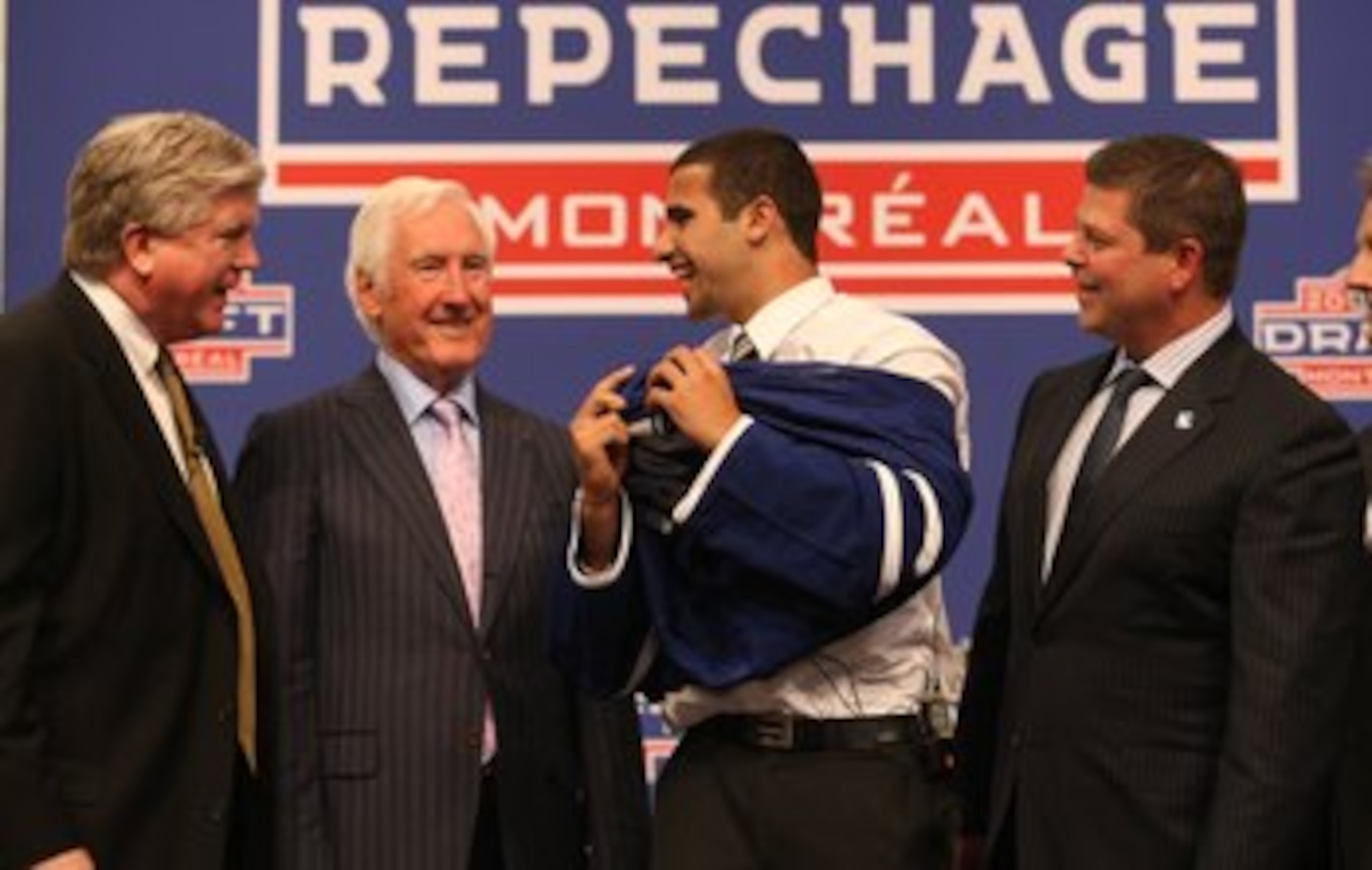 MONTREAL - JUNE 26: (L-R) Toronto Maple Leafs President & GM Brian Burke, Special Advisor Cliff Fletcher, First Round Draft Pick Nazem Kadri and Senior VP of Hockey Operations Dave Nonis stand on the stage during the first round of the 2009 NHL Entry Dr MONTREAL - JUNE 26: (L-R) Toronto Maple Leafs President & GM Brian Burke, Special Advisor Cliff Fletcher, First Round Draft Pick Nazem Kadri and Senior VP of Hockey Operations Dave Nonis stand on the stage during the first round of the 2009 NHL Entry Dr