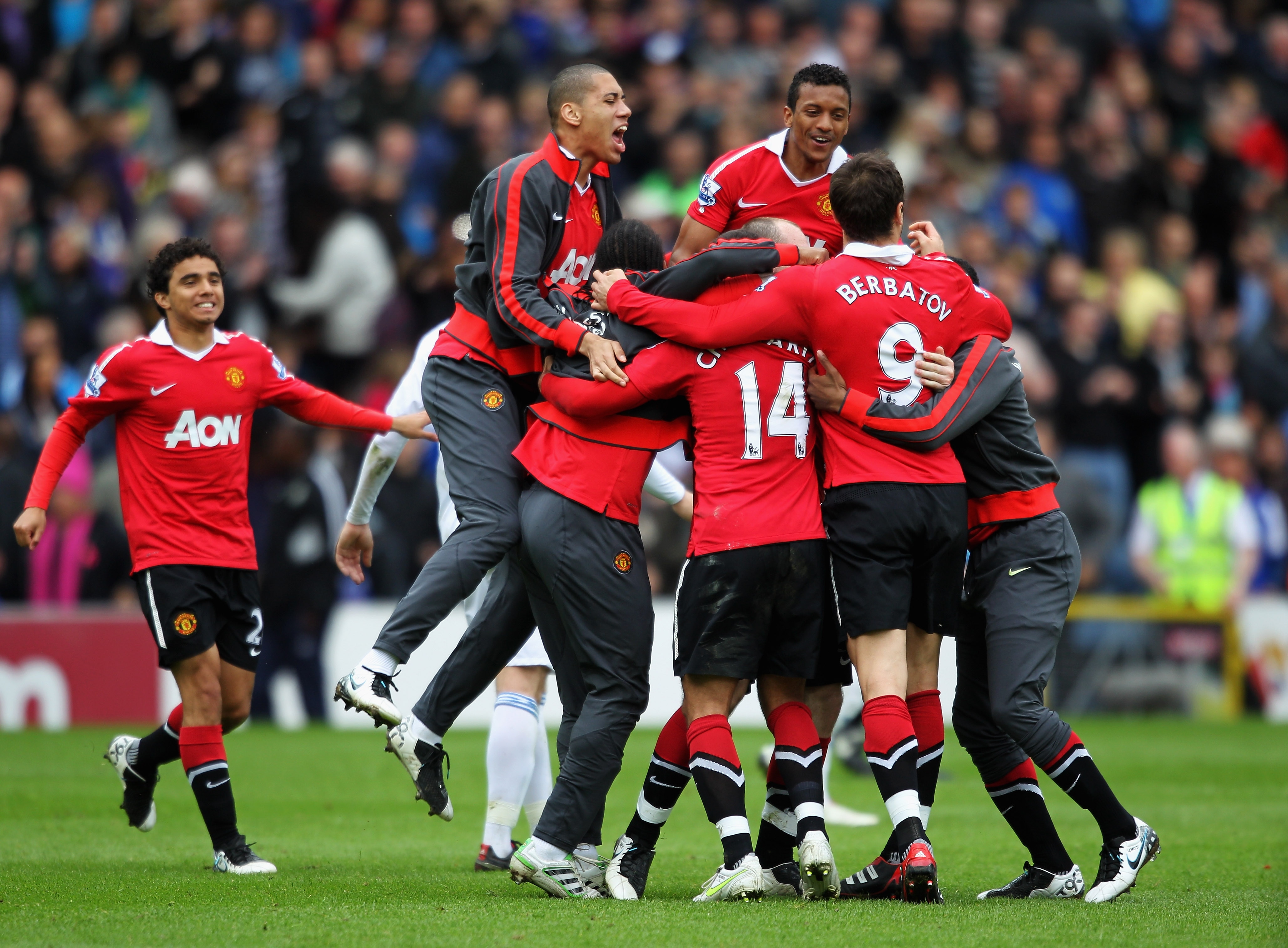 BLACKBURN, ENGLAND - MAY 14:  (L-R)  Rio Ferdinand, Wayne Rooney and Nani of Manchester United celebrate after drawing the Barclays Premier League match between Blackburn Rovers and Manchester United but winning the title at Ewood park on May 14, 2011 in
