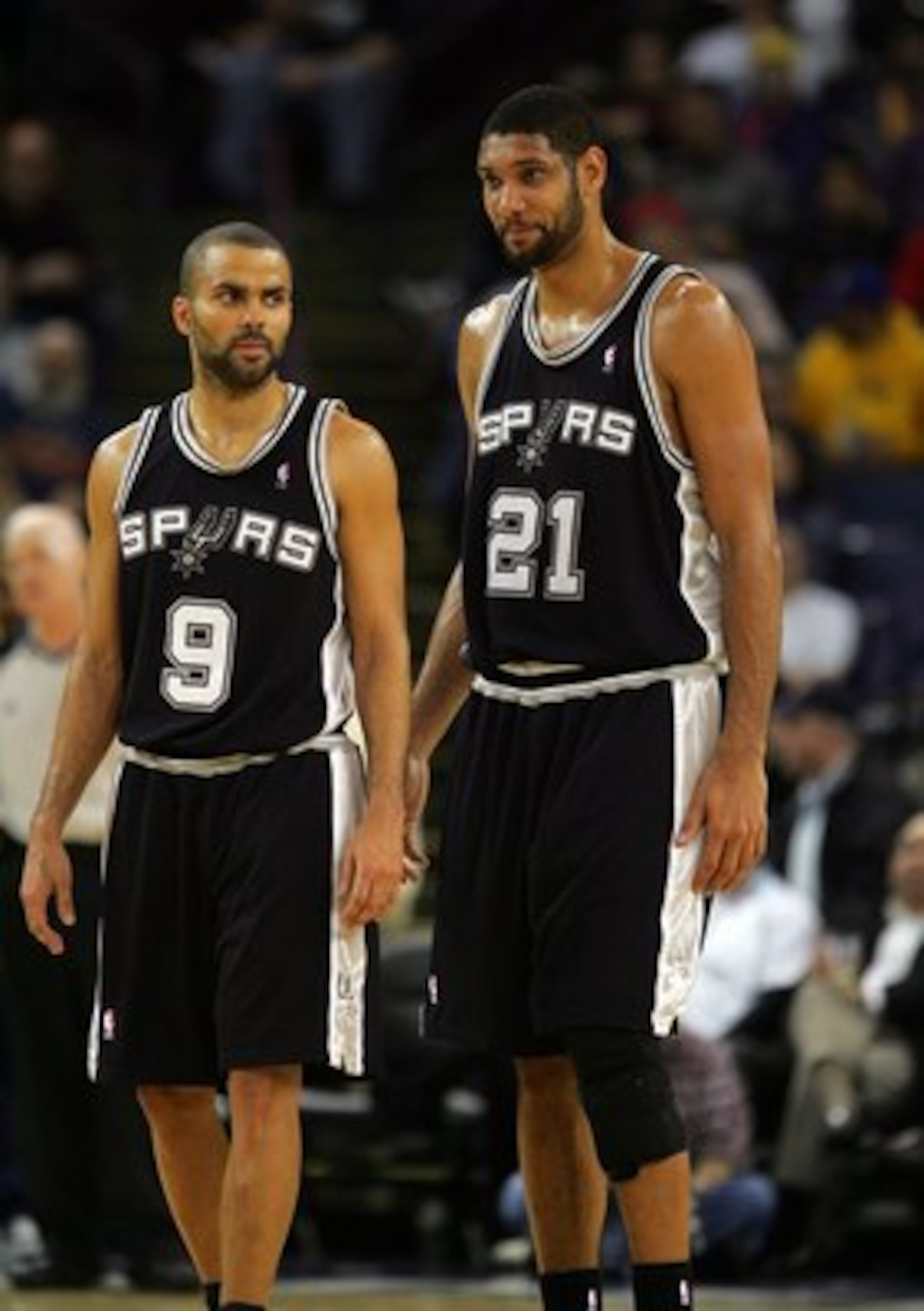 OAKLAND, CA - DECEMBER 16: Tim Duncan #21 and Tony Parker #9 of the San Antonio Spurs stand on the court during their game against the Golden State Warriors at Oracle Arena on December 16, 2009 in Oakland, California. NOTE TO USER: User expressly acknowl OAKLAND, CA - DECEMBER 16: Tim Duncan #21 and Tony Parker #9 of the San Antonio Spurs stand on the court during their game against the Golden State Warriors at Oracle Arena on December 16, 2009 in Oakland, California. NOTE TO USER: User expressly acknowl