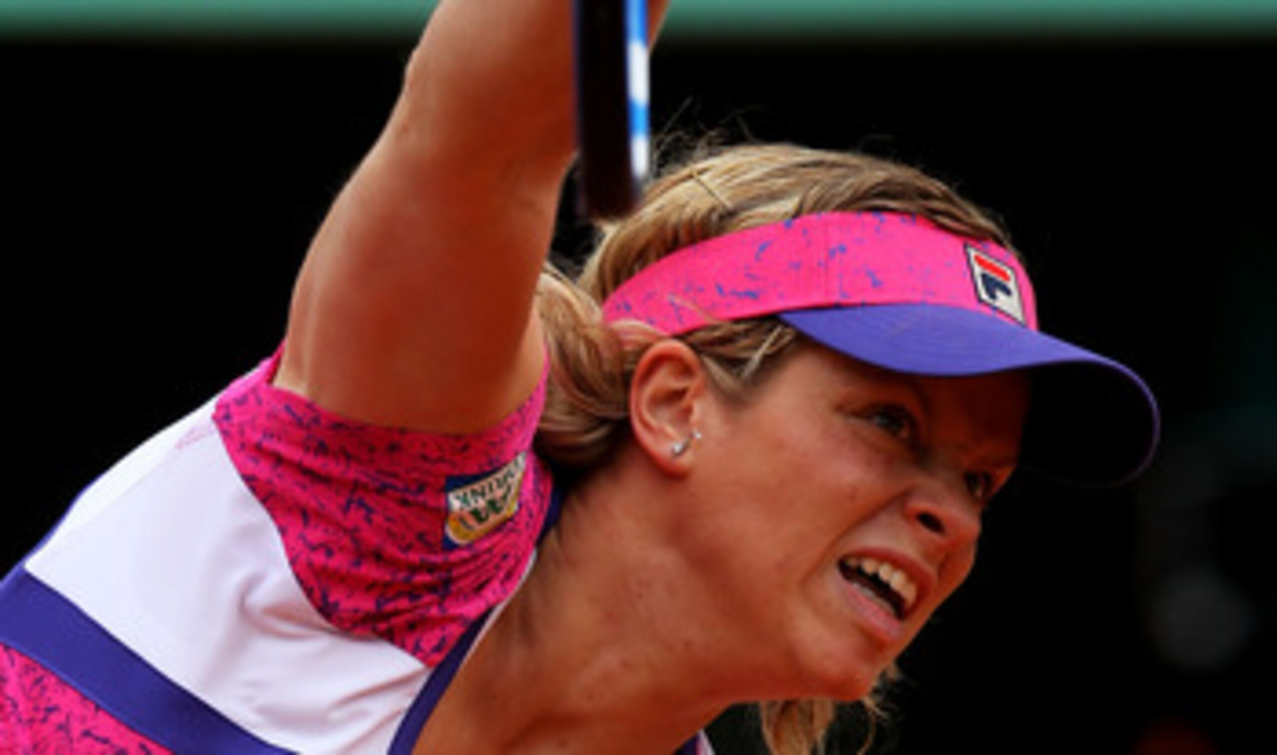 PARIS, FRANCE - MAY 26:  Kim Clijsters of Belgium serves during the women's singles round two match between Arantxa Rus of Netherlands and Kim Clijsters of Belgium on day five of the French Open at Roland Garros on May 26, 2011 in Paris, France.  (Photo b
