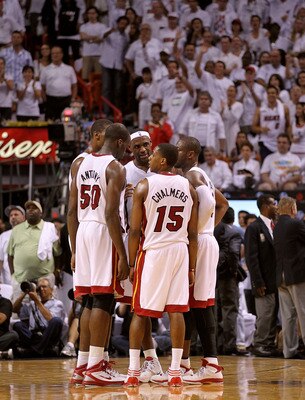 MIAMI, FL - MAY 01:  LeBron James #6, Dwyane Wade #2, Chris Bosh #1, Mario Chalmers #15, and Joel Anthony #50 of the Miami Heat talk during Game One of the Eastern Conference Semifinals of the 2011 NBA Playoffs against the Boston Celtics at American Airli