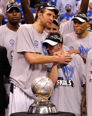 DALLAS, TX - MAY 25:  Dirk Nowitzki #41, Jose Juan Barea #11 and the Dallas Mavericks celebrate their 100-96 victory against the Oklahoma City Thunder in Game Five of the Western Conference Finals during the 2011 NBA Playoffs at American Airlines Center o