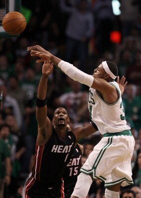BOSTON, MA - MAY 09:  Paul Pierce #34 of the Boston Celtics passes the ball as Chris Bosh #1 of the Miami Heat defends in Game Four of the Eastern Conference Semifinals in the 2011 NBA Playoffs on May 9, 2011 at the TD Garden in Boston, Massachusetts.  Th