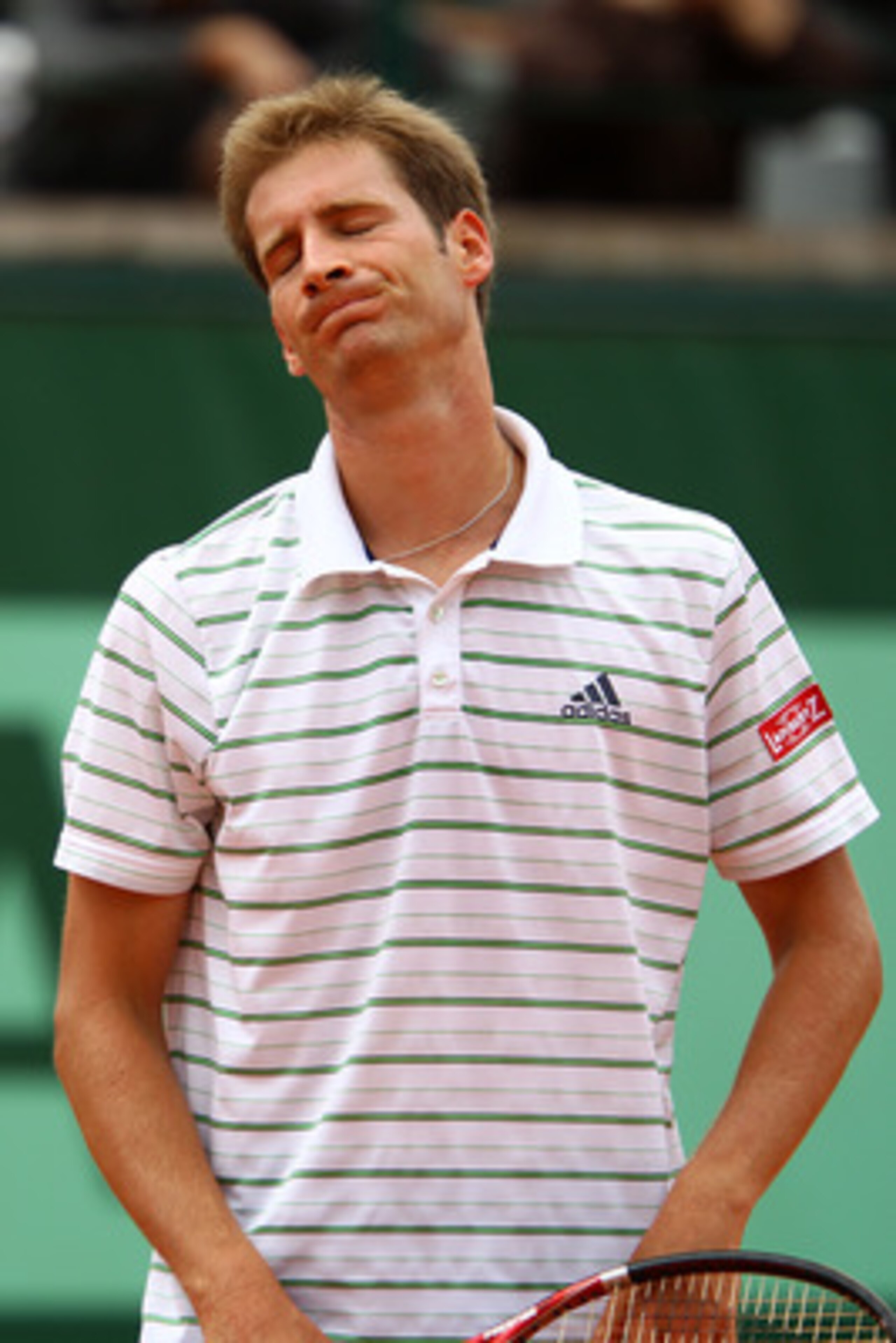 PARIS, FRANCE - MAY 26:  Florian Mayer of Germany shows his dejection during the men's singles round two match between Alejandro Falla of Columbia and Florian Mayer of Germany on day five of the French Open at Roland Garros on May 26, 2011 in Paris, Franc