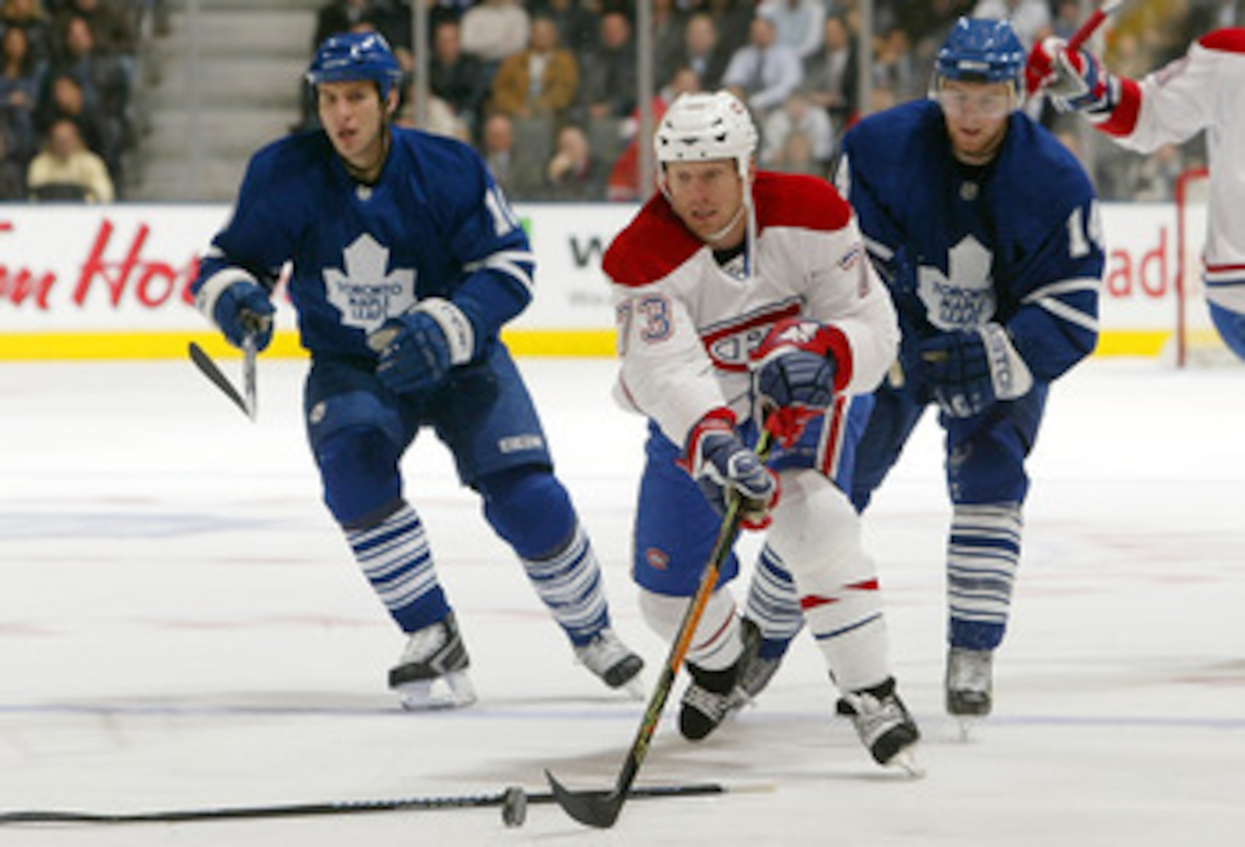 TORONTO - NOVEMBER 27: Michael Ryder #73 of the Montreal Canadiens carries the puck past Alex Steen #10 and Matt Stajan #14 both of the Toronto Maple Leafs at the Air Canada Centre November 27, 2007 in Toronto, Ontario. (Photo by Dave Sandford/Getty Imag TORONTO - NOVEMBER 27: Michael Ryder #73 of the Montreal Canadiens carries the puck past Alex Steen #10 and Matt Stajan #14 both of the Toronto Maple Leafs at the Air Canada Centre November 27, 2007 in Toronto, Ontario. (Photo by Dave Sandford/Getty Imag