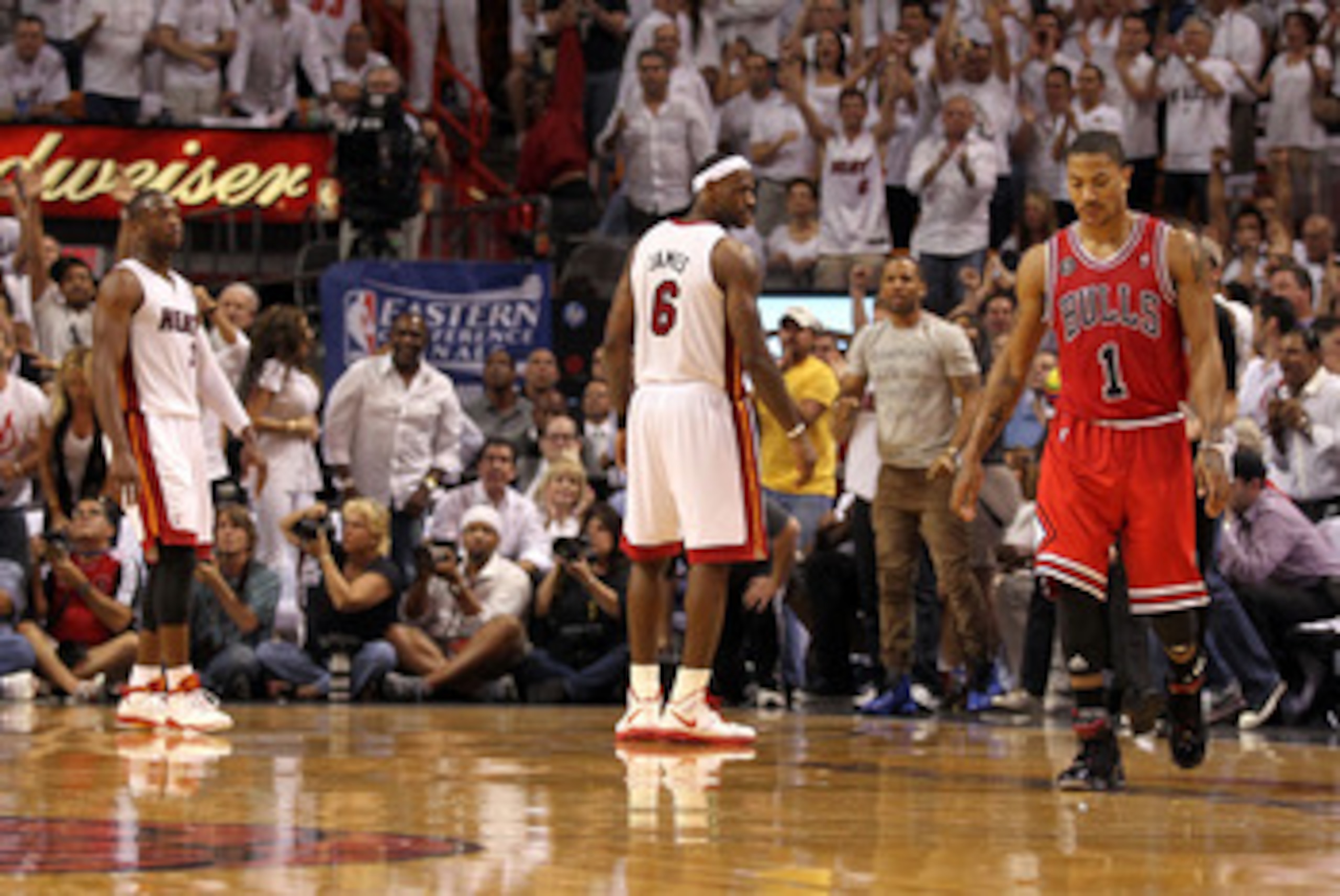 MIAMI, FL - MAY 24: Derrick Rose #1 of the Chicago Bulls walks up court as LeBron James #6 (C) and Dwyane Wade #3 of the Miami Heat look on in Game Four of the Eastern Conference Finals during the 2011 NBA Playoffs on May 24, 2011 at American Airlines Are