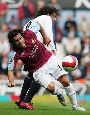LONDON - MAY 05:  Carlos Tevez (L) of West Ham United is challenged by Ivan Campo (R) of Bolton Wanderers during the Barclays Premiership match between West Ham United and Bolton Wanderers at Upton Park on May 5, 2007 in London, England.  (Photo by Christ