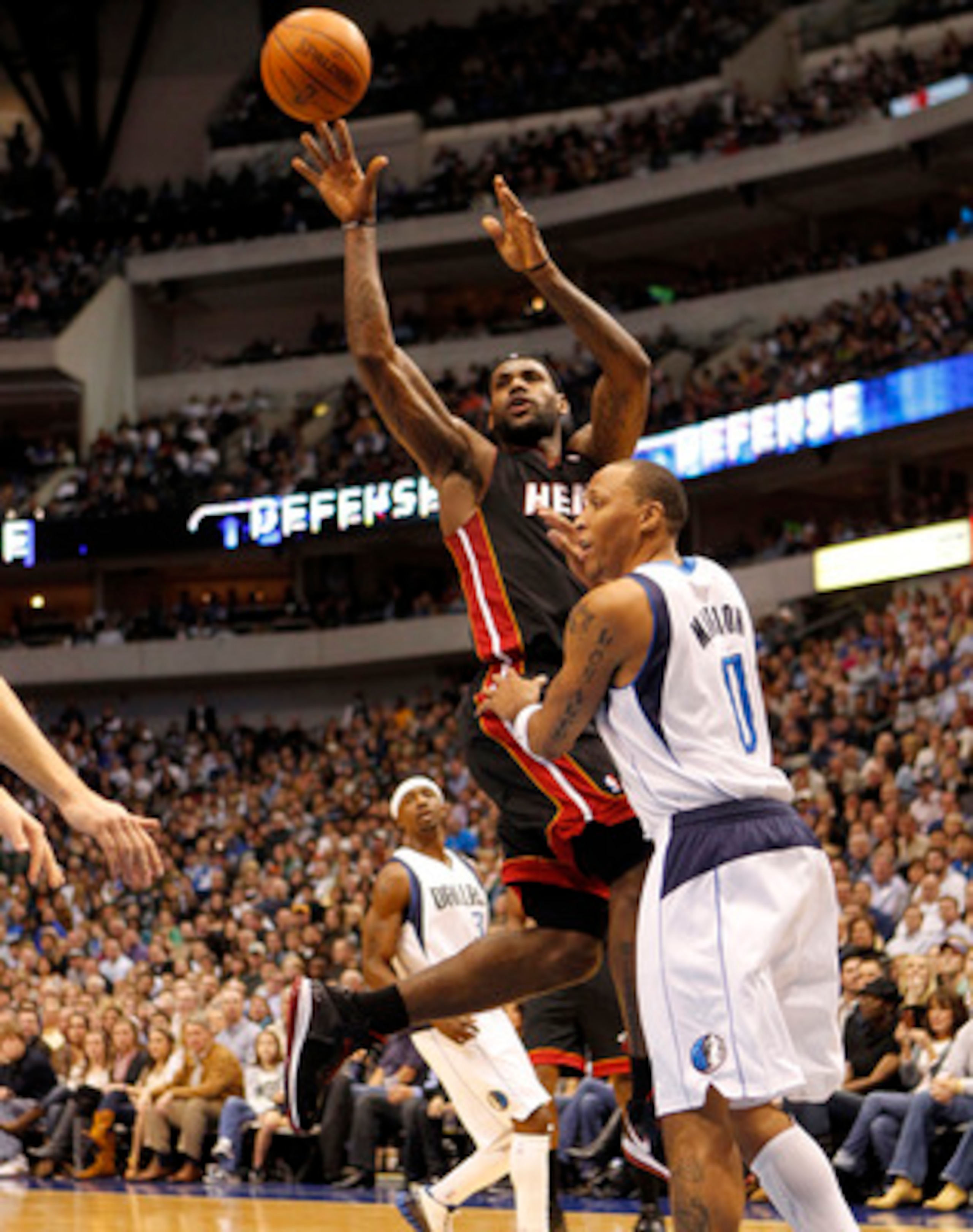 DALLAS - NOVEMBER 27: Lebron James #6 of the Miami Heat shoots over Shawn Marion #0 of the Dallas Mavericks on November 27, 2010 at the American Airlines Center in Dallas, Texas. NOTE TO USER: User expressly acknowledges and agrees that, by downloading an