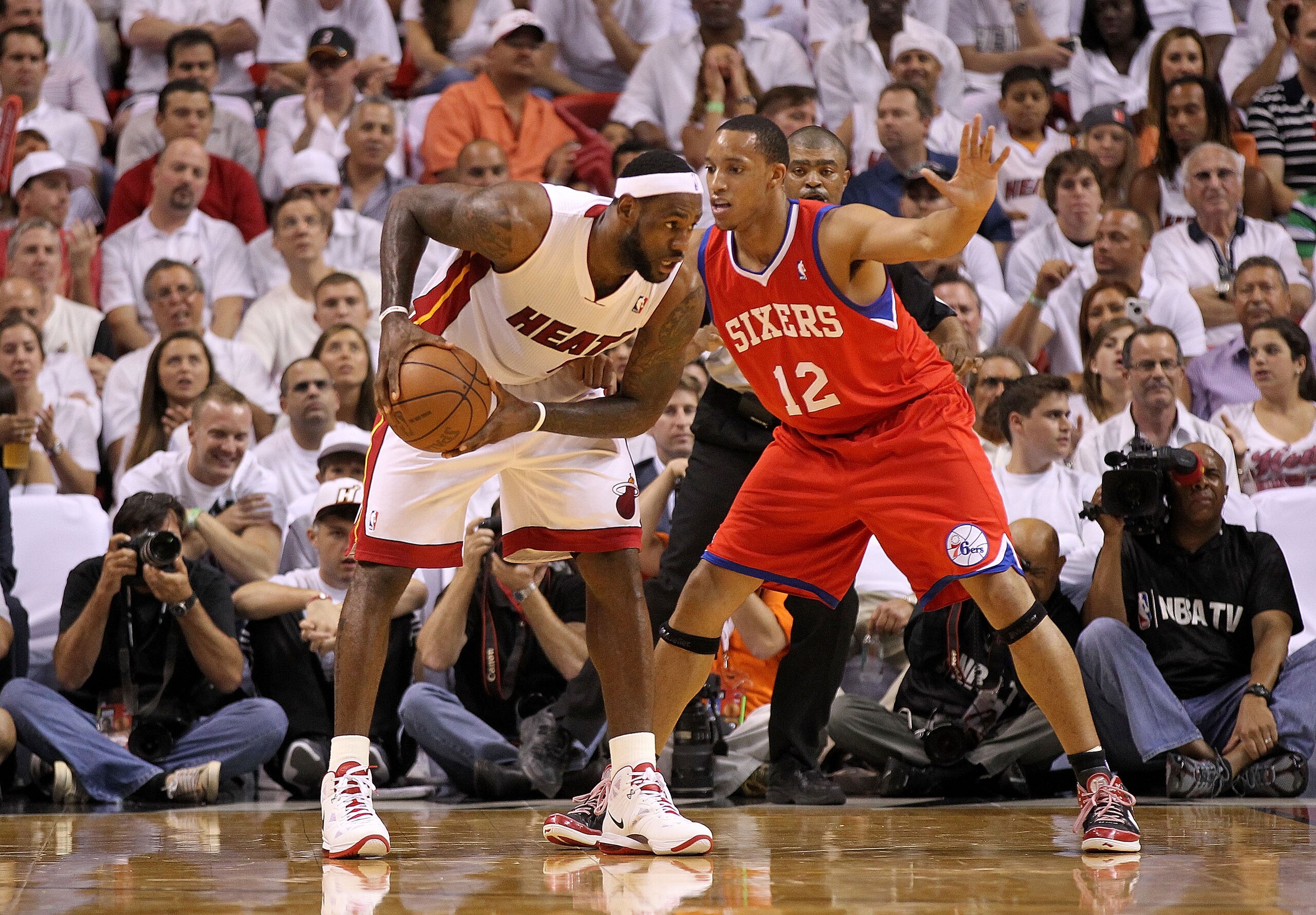 MIAMI, FL - APRIL 27:  LeBron James #6 of the Miami Heat posts up against Evan Turner #12 of the Philadelphia 76ers during game five of the Eastern Conference Quarterfinals in the 2011 NBA Playoffs at American Airlines Arena on April 27, 2011 in Miami, Fl