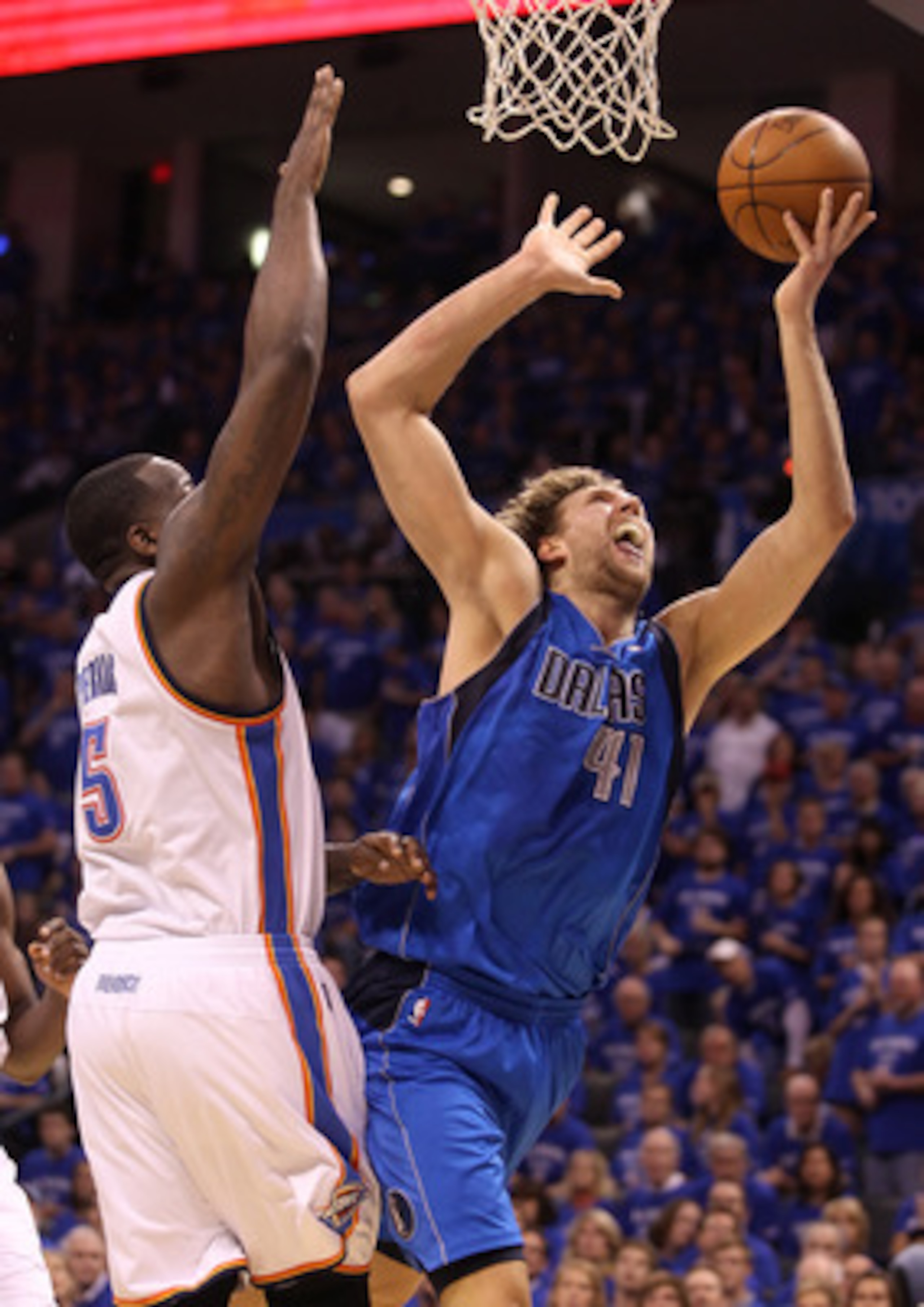 OKLAHOMA CITY, OK - MAY 23:  Dirk Nowitzki #41 of the Dallas Mavericks goes up for a shot against Kendrick Perkins #5 of the Oklahoma City Thunder in the first half of Game Four of the Western Conference Finals during the 2011 NBA Playoffs at Oklahoma Cit
